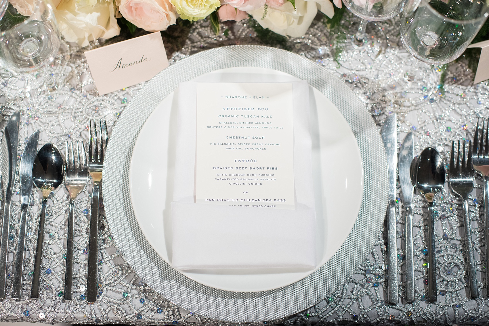 Mikkel Paige Photography wedding photos at The Glasshouses NYC. Luxury rectangle tables with silver sparkly tablecloths and floral garland with pink and white roses at a posh Manhattan venue.