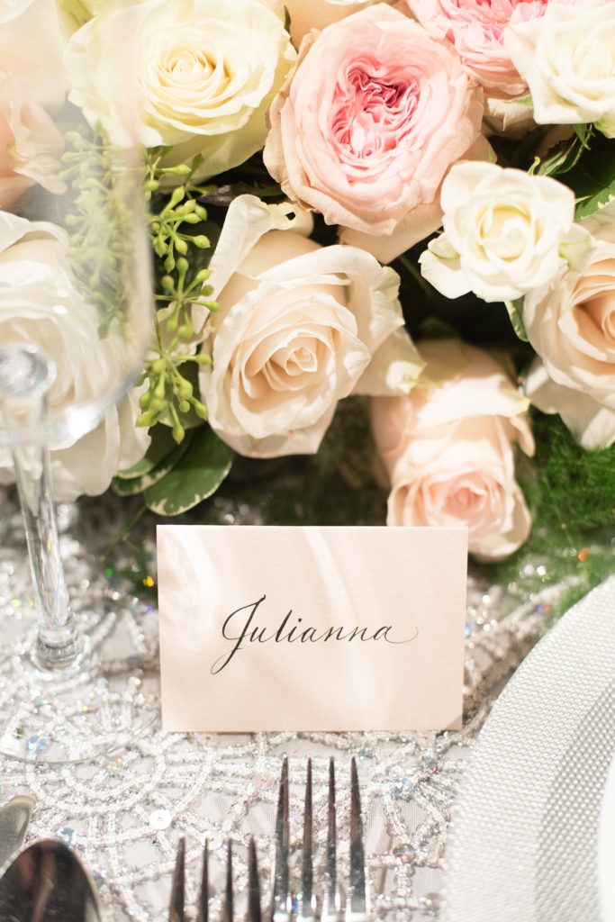 Mikkel Paige Photography wedding photos at The Glasshouses NYC. Luxury reception with silver, light pink and white detail and table cards in blush with black calligraphy.