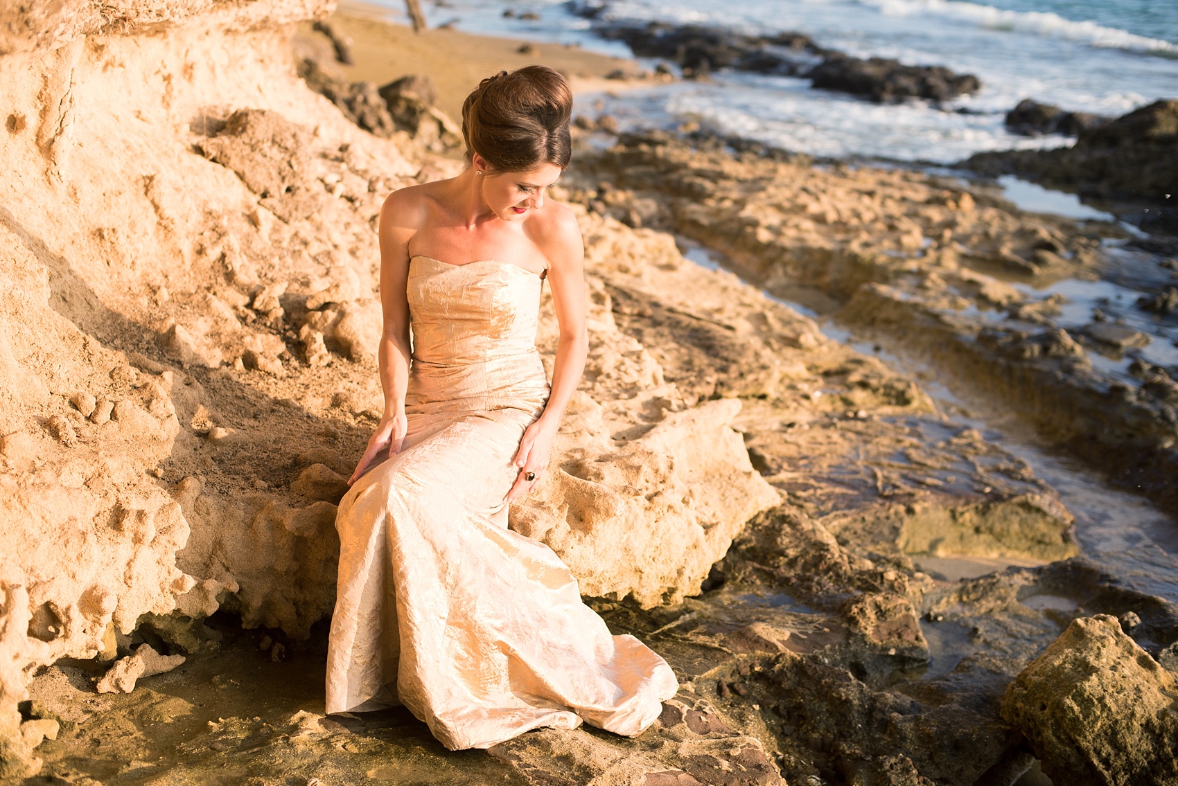 Mikkel Paige Photography photos of a bridal session on beach in Oahu. Golden hour bride with beehive up do and metallic gown. 