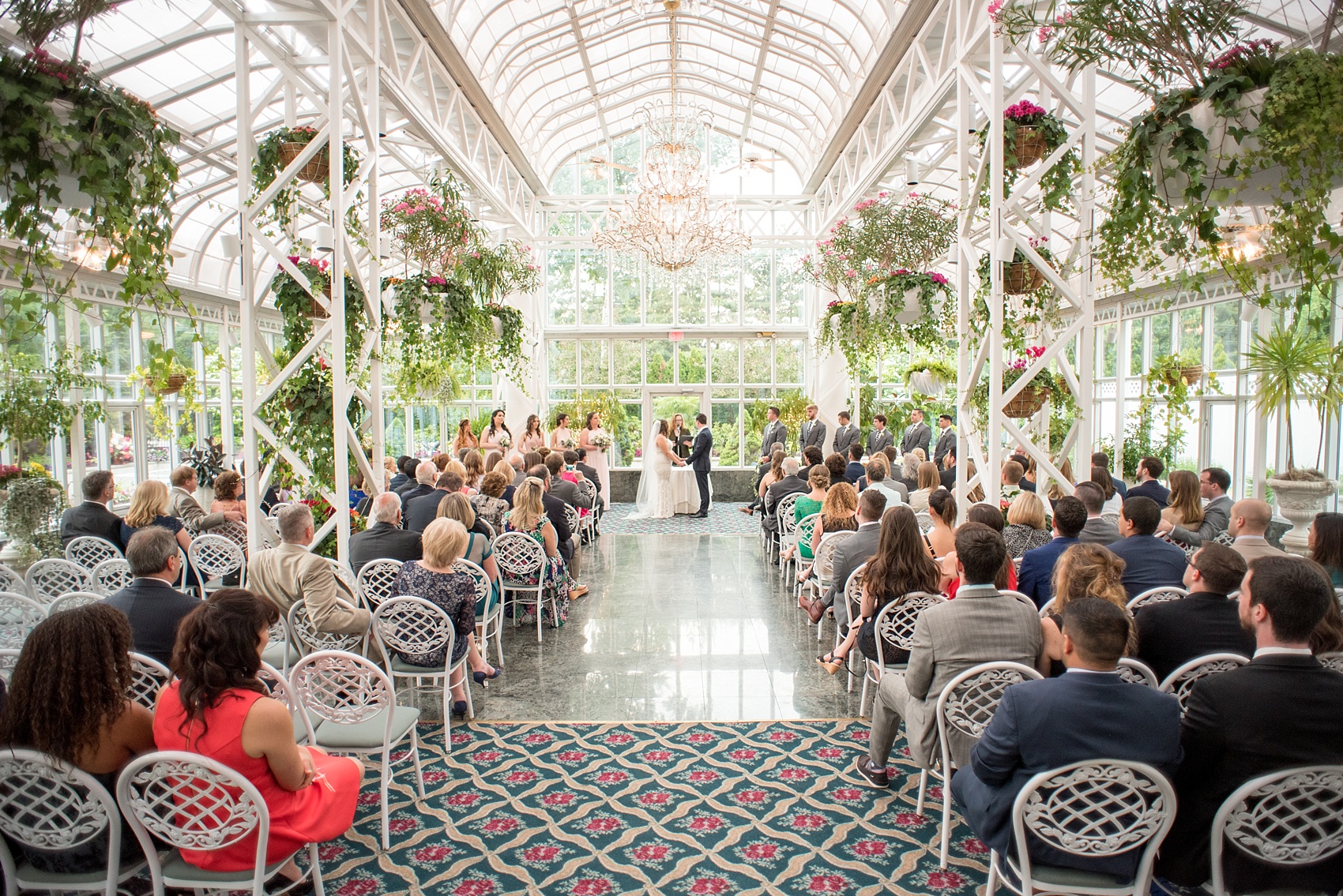 Mikkel Paige Photography photo of a wedding at the Madison Hotel in NJ. Image of the bride and groom at their greenhouse like ceremony at The Conservatory.