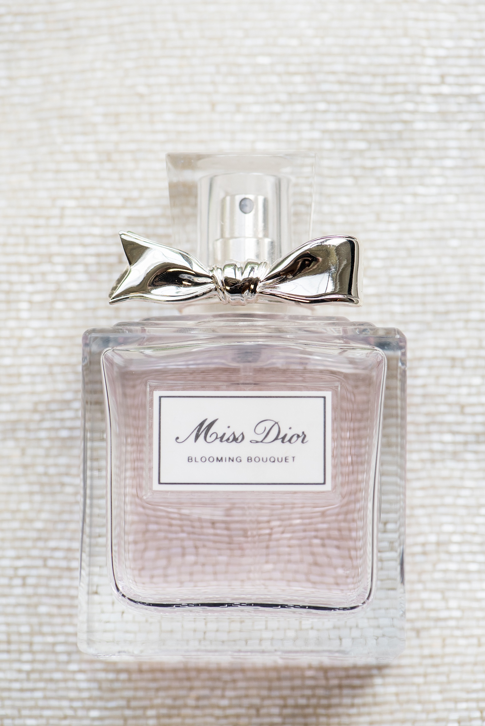 Mikkel Paige Photography photo of a wedding at the Madison Hotel in NJ. Image of the bride's Miss Dior perfume.