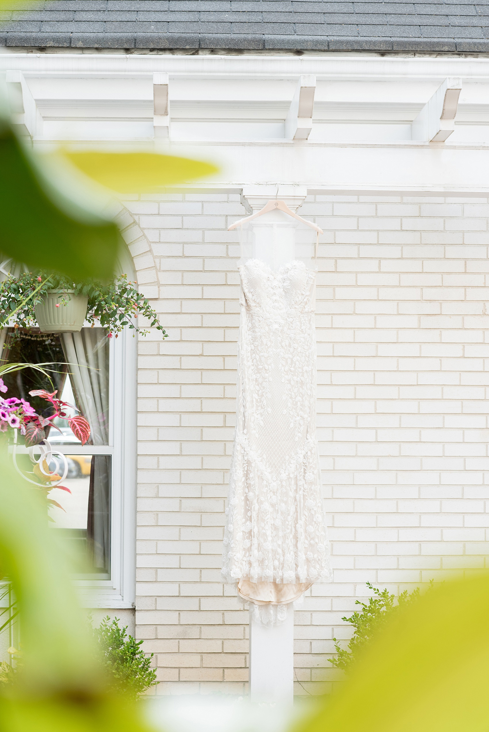 Mikkel Paige Photography photo of a wedding at the Madison Hotel in NJ. Image of the bride's beading detail on her BHLDN gown.