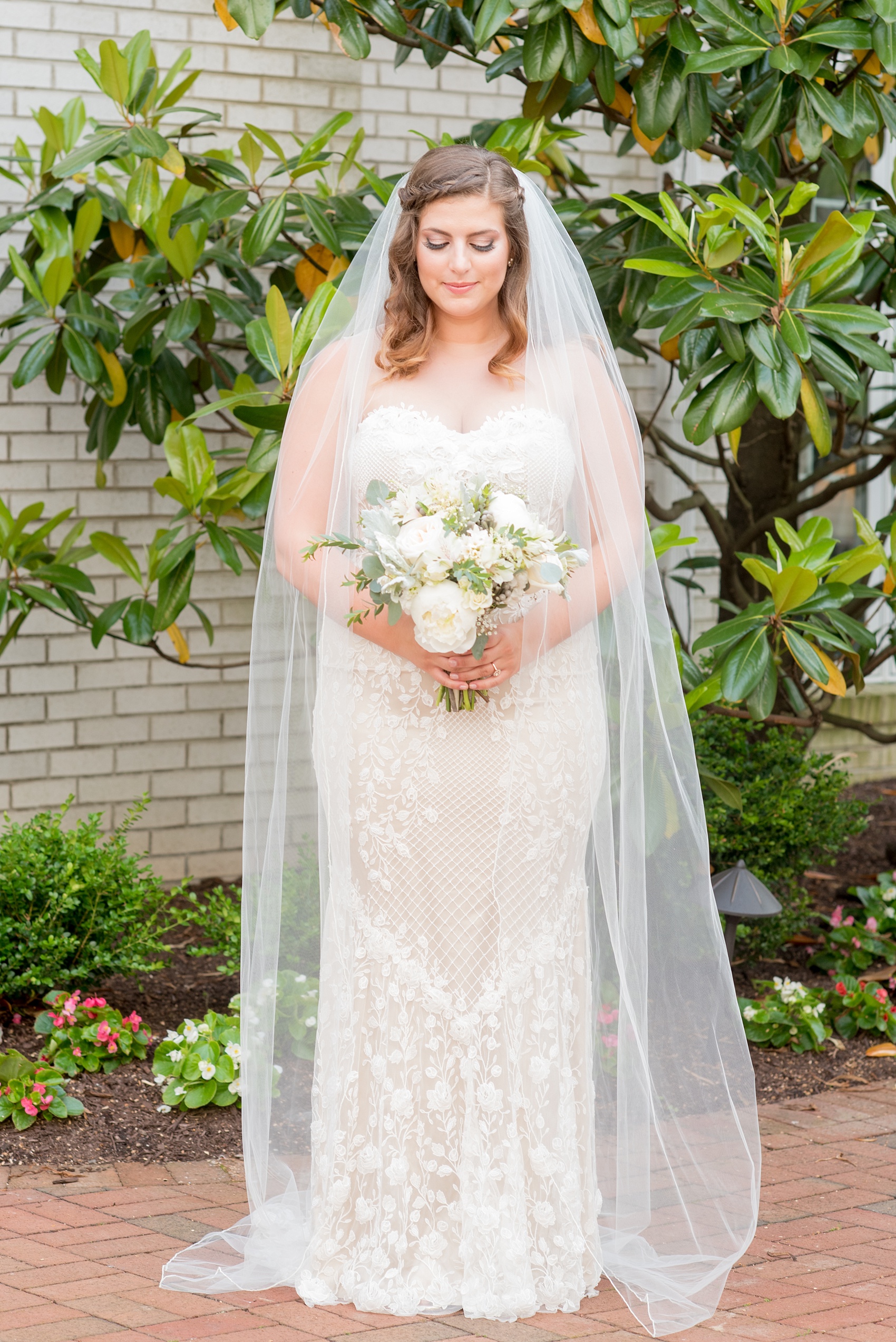 Mikkel Paige Photography photo of a wedding at the Madison Hotel in NJ. Image of the bride in her veil and fitted, beaded BHLDN gown.