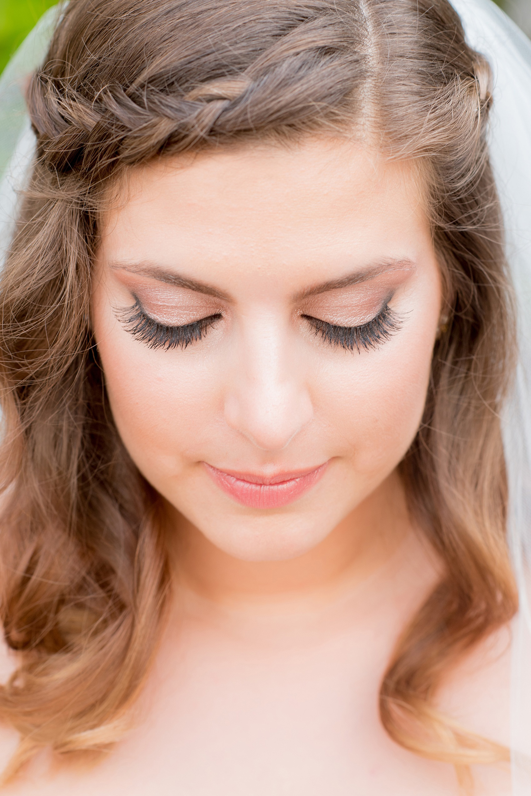 Mikkel Paige Photography photo of a wedding at the Madison Hotel in NJ. Image of the bride in her fitted, beaded BHLDN gown with makeup and lashes.