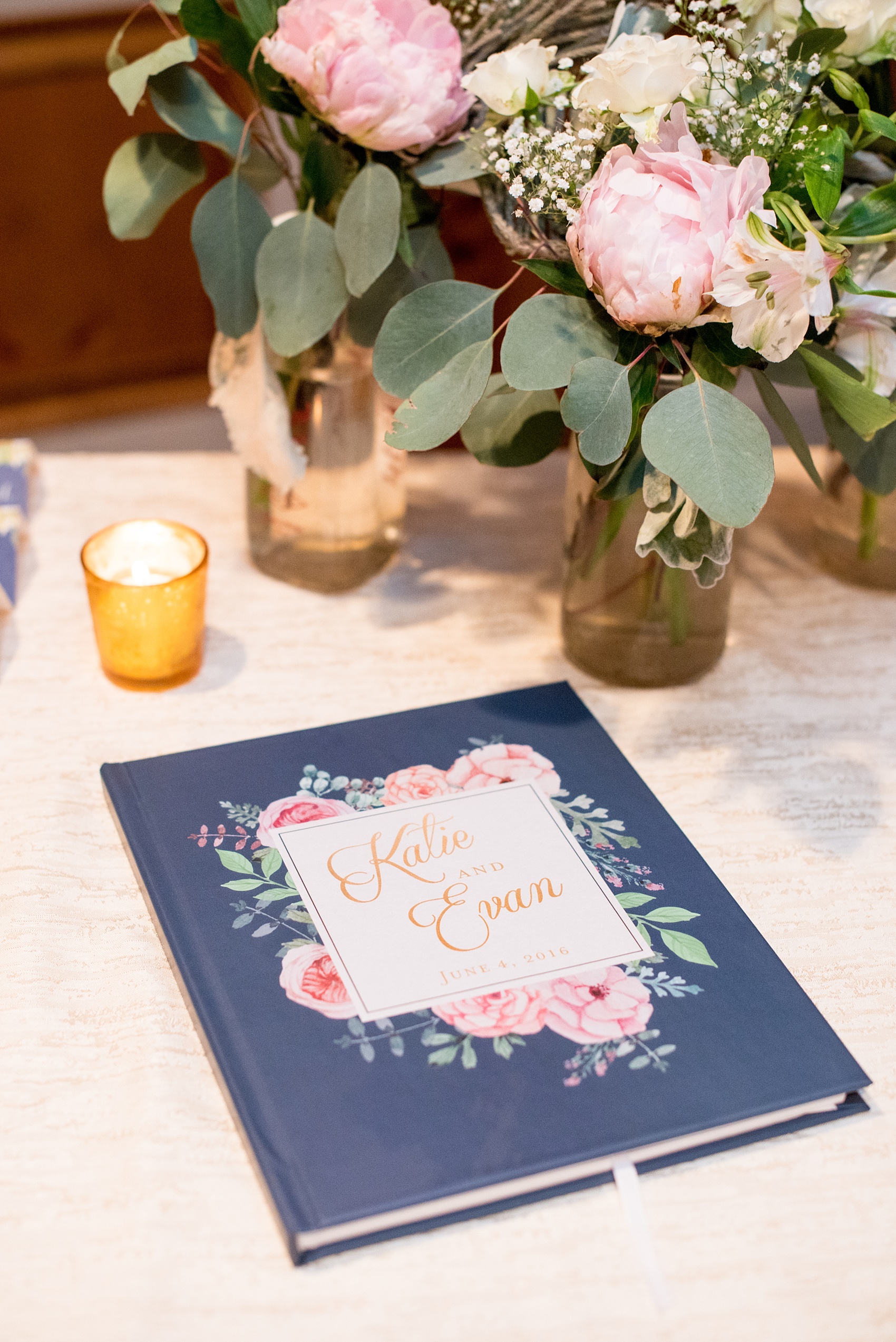 Mikkel Paige Photography photo of a wedding at the Madison Hotel in NJ. Image of the navy floral guest book.