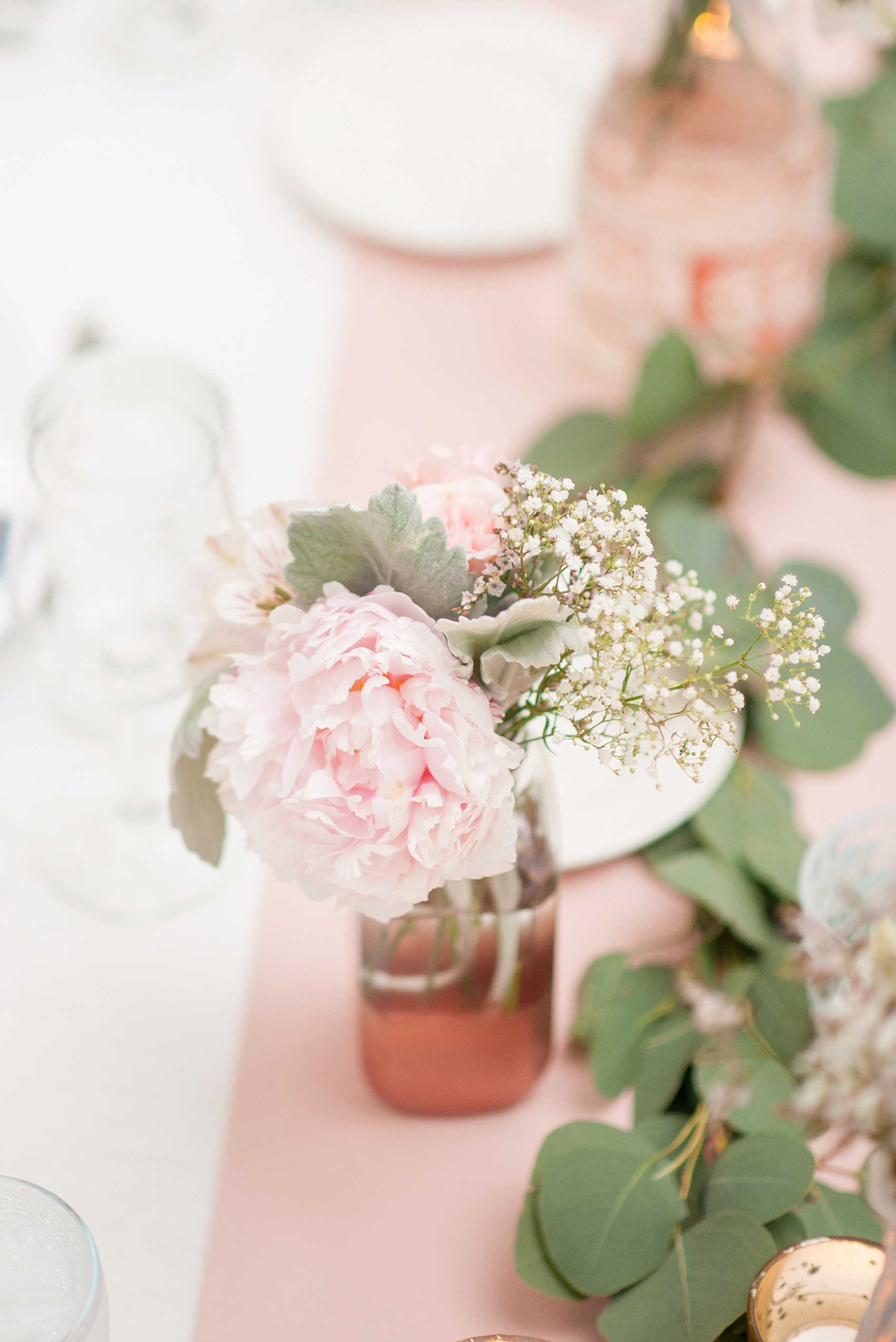 Mikkel Paige Photography photo of a wedding at the Madison Hotel in NJ. Photo of the white table at the reception in The Conservatory with pink peonies in bud vases.