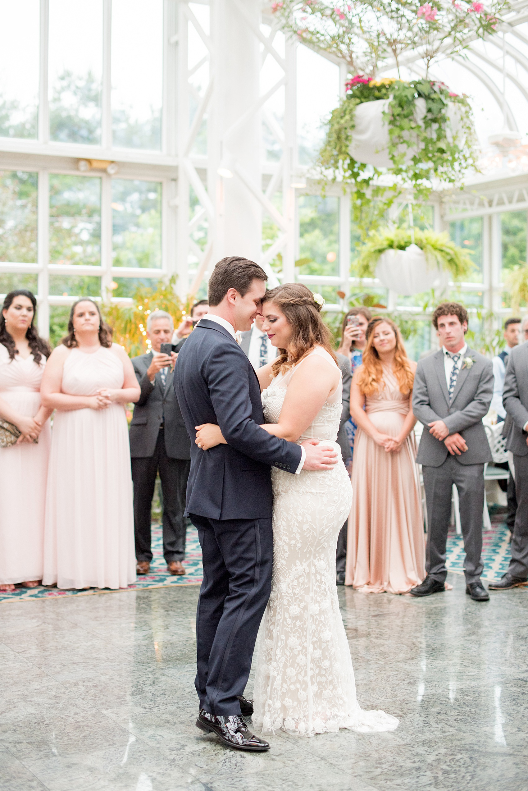 Mikkel Paige Photography photo of a wedding at Madison Hotel in NJ. Photo of the couple's first dance in The Conservatory.