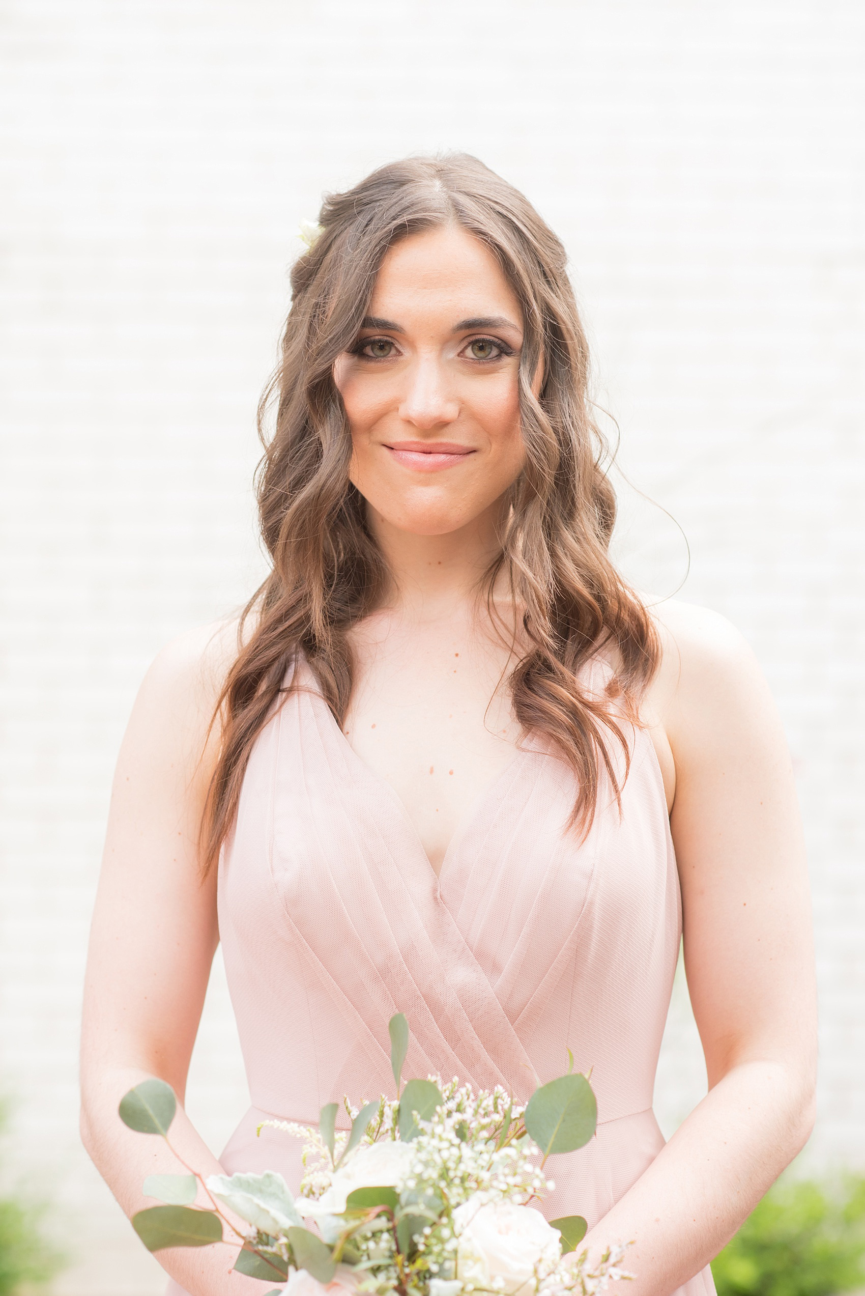 Mikkel Paige Photography photo of a wedding at Madison Hotel in NJ with the bridal party in light pink mismatched dresses.