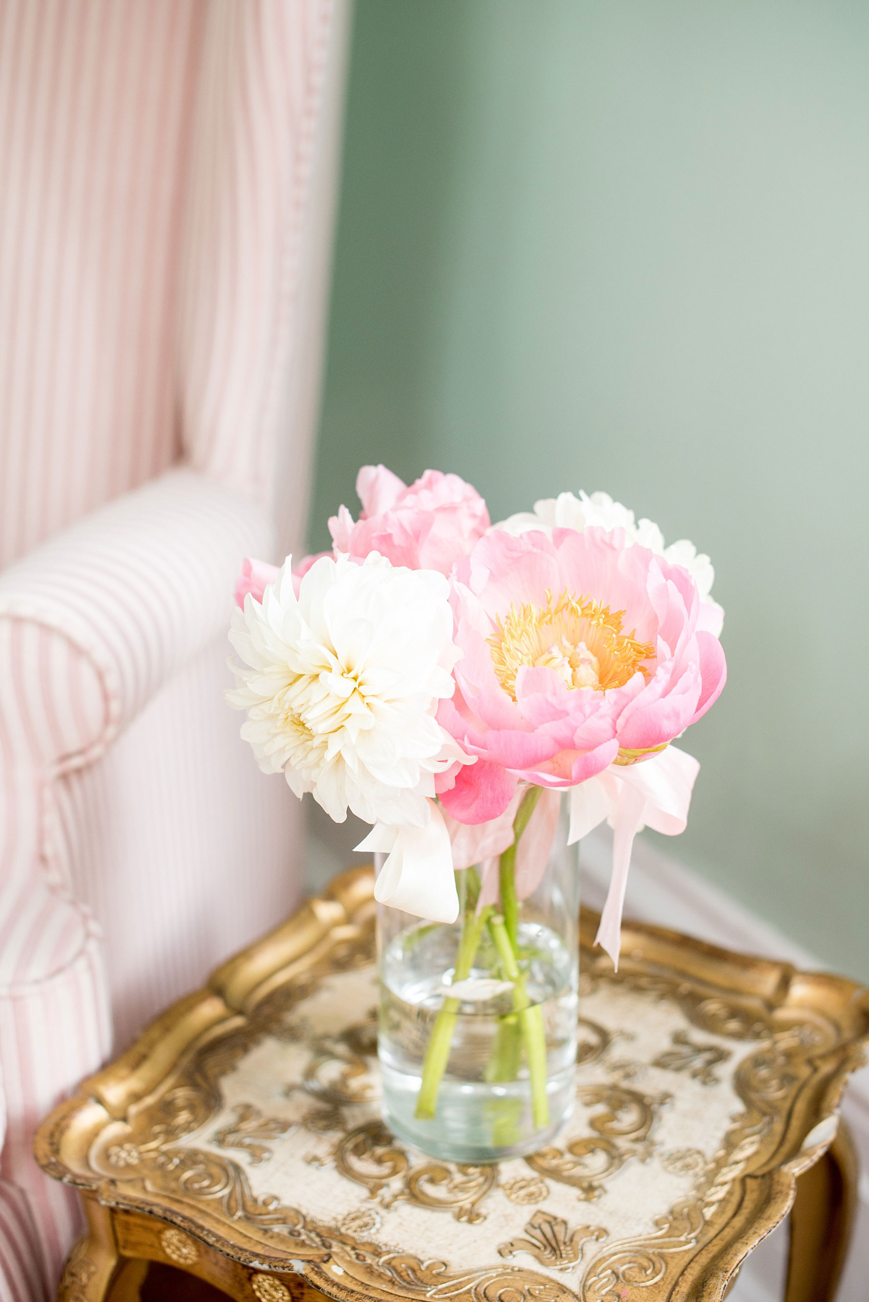 Mikkel Paige Photography wedding photos at The Merrimon-Wynne House in downtown Raleigh. Single stem peonies tied with ribbon for the mothers by Meristem Floral.