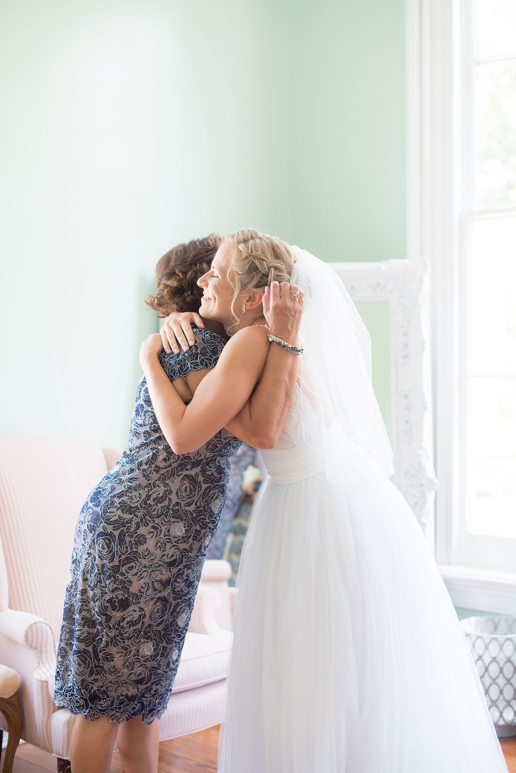 Mikkel Paige Photography wedding photos at The Merrimon-Wynne House in downtown Raleigh. The bride shares a moment with her mother.