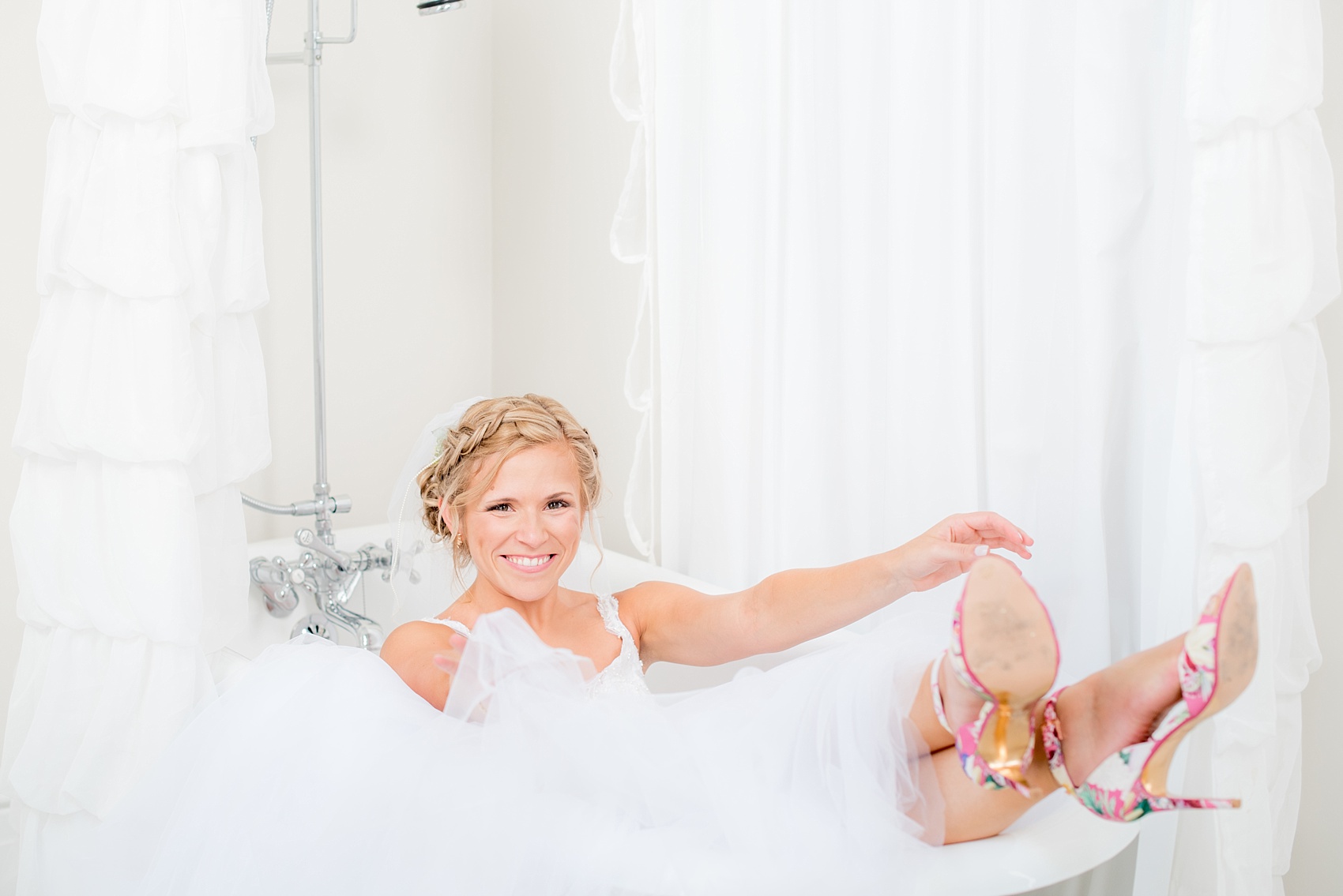 Mikkel Paige Photography wedding photos at The Merrimon-Wynne House in downtown Raleigh. A bridal portrait with the bride's tulle skirt in the claw foot tub of the North Carolina venue.