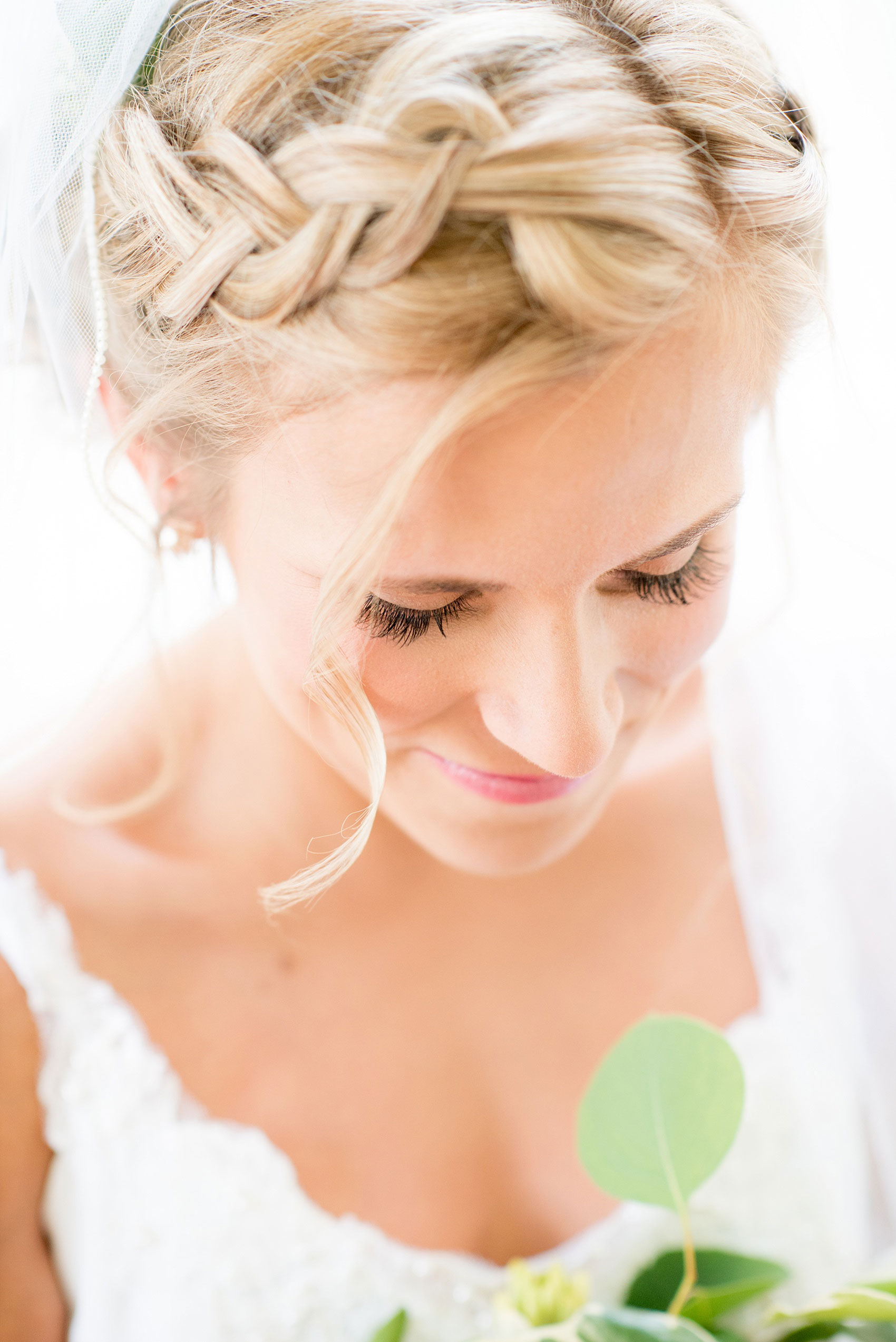 Mikkel Paige Photography wedding photos at The Merrimon-Wynne House in downtown Raleigh. A close up bridal portrait with full lashes and reverse-braid, crown hair up-do.