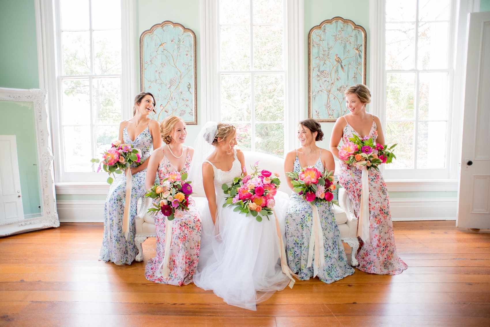 Mikkel Paige Photography wedding photos at The Merrimon-Wynne House in downtown Raleigh. Bridal party in floral maxi dresses in blue and pink and colorful garden rose and peony bouquets.