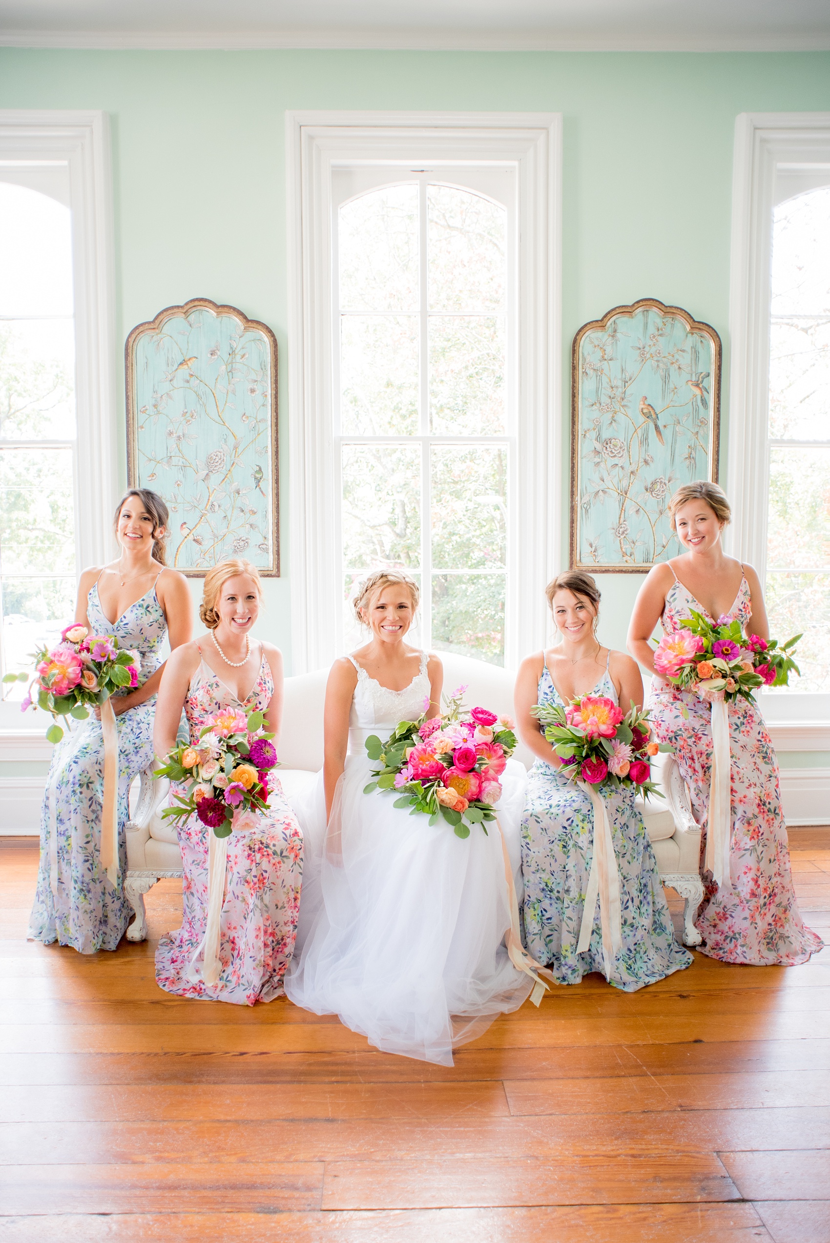 Mikkel Paige Photography wedding photos at The Merrimon-Wynne House in downtown Raleigh. Bridal party in floral maxi dresses in blue and pink and colorful garden rose and peony bouquets.