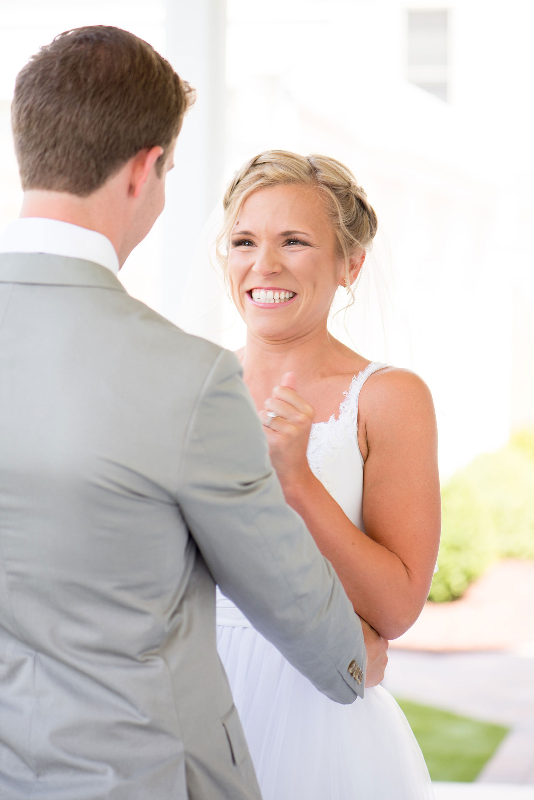 Mikkel Paige Photography wedding photos at The Merrimon-Wynne House in downtown Raleigh. The bride's reaction to hers and the groom's first look on the southern porch.