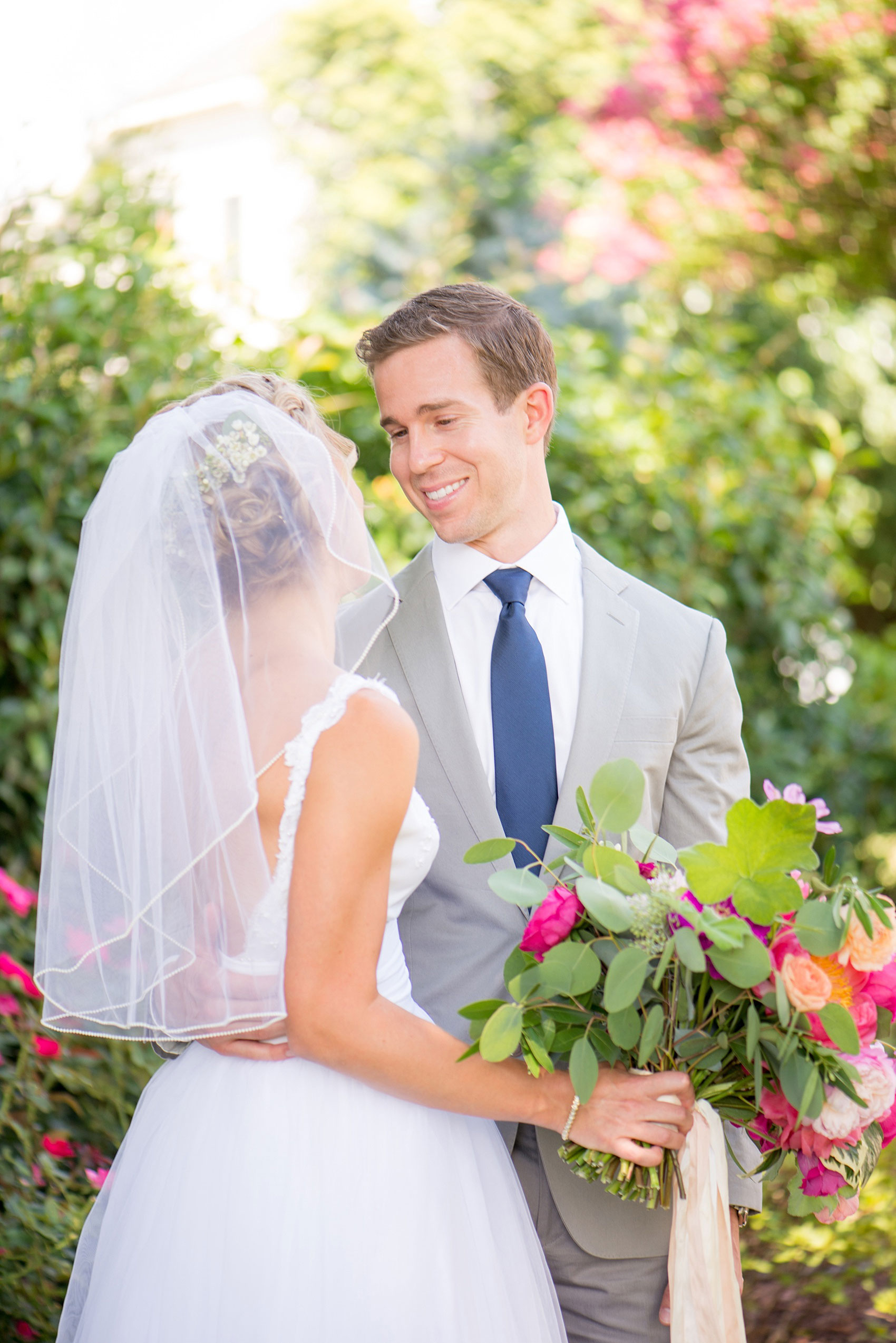 Mikkel Paige Photography wedding photos at The Merrimon-Wynne House in downtown Raleigh. The bride and groom with colorful bouquet and low-back dress.