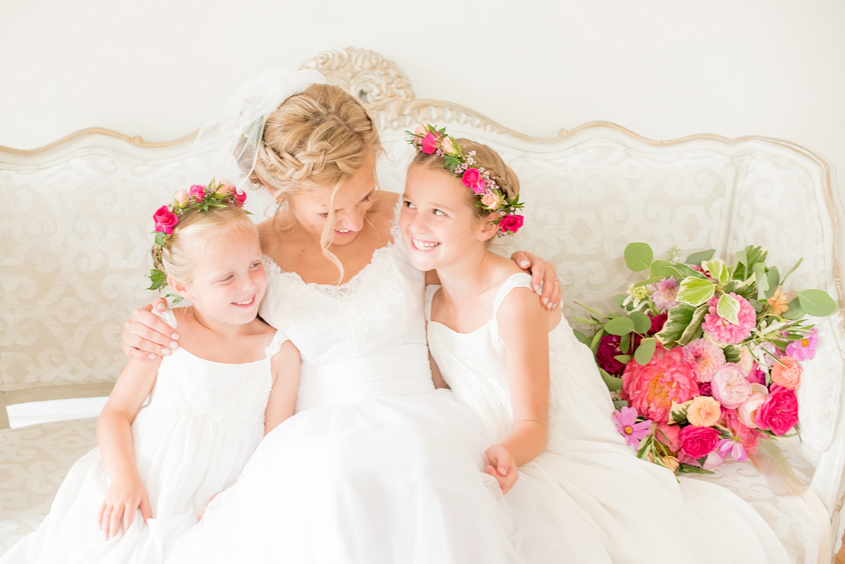 Mikkel Paige Photography wedding photos at The Merrimon-Wynne House in downtown Raleigh. The bride with her two flower girls in colorful floral crowns by Meristem Floral.