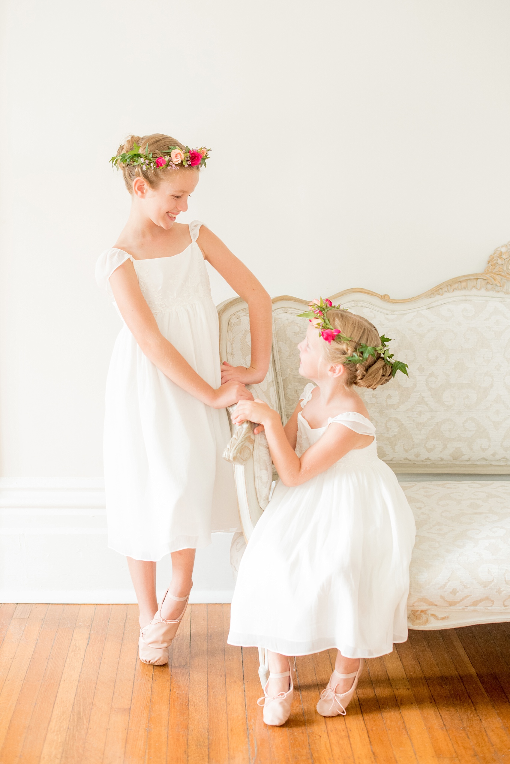 Mikkel Paige Photography wedding photos at The Merrimon-Wynne House in downtown Raleigh. The bride with her two flower girls in colorful floral crowns by Meristem Floral.