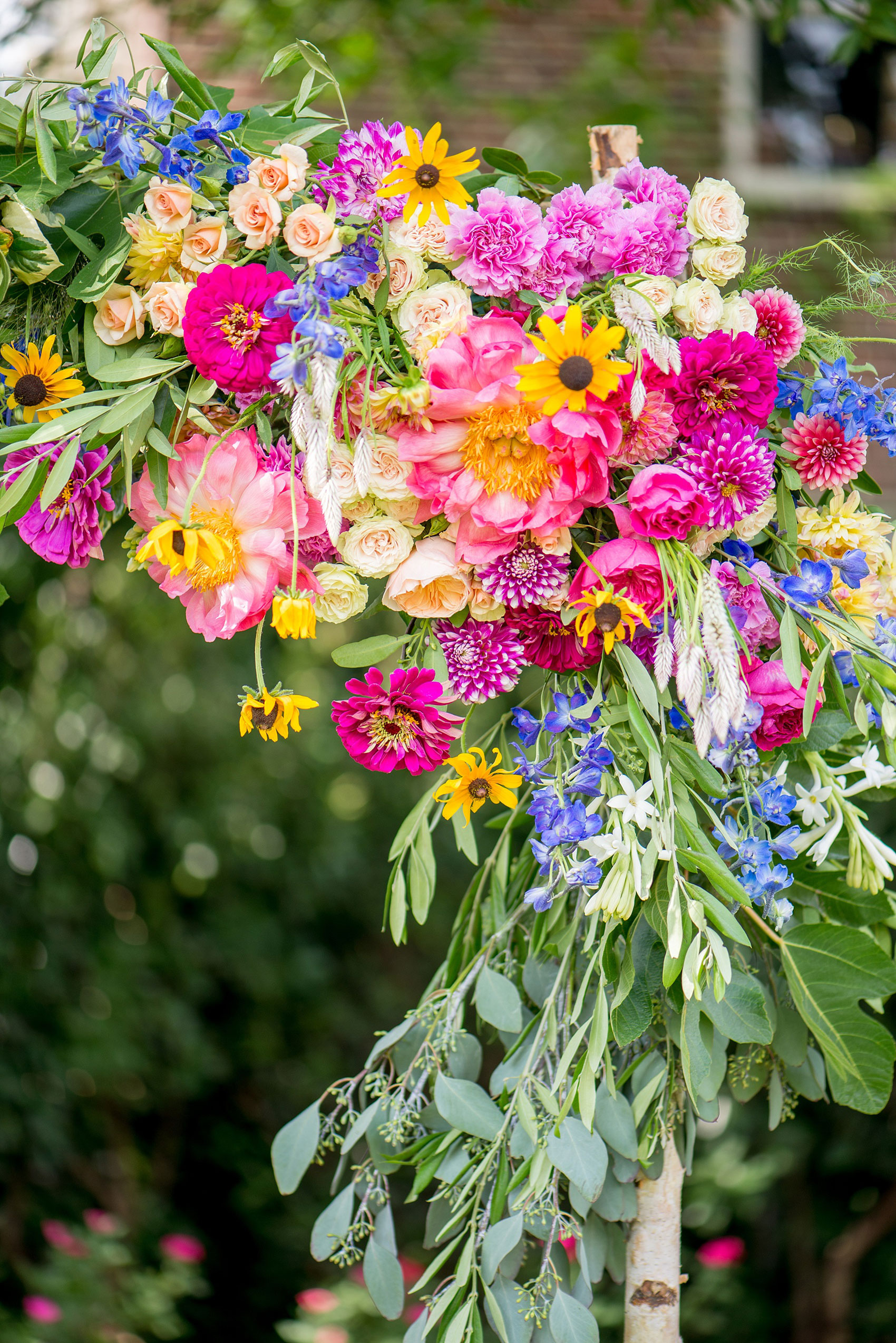 Mikkel Paige Photography wedding photos at The Merrimon-Wynne House in downtown Raleigh. Outdoor ceremony with a very bright floral arch.