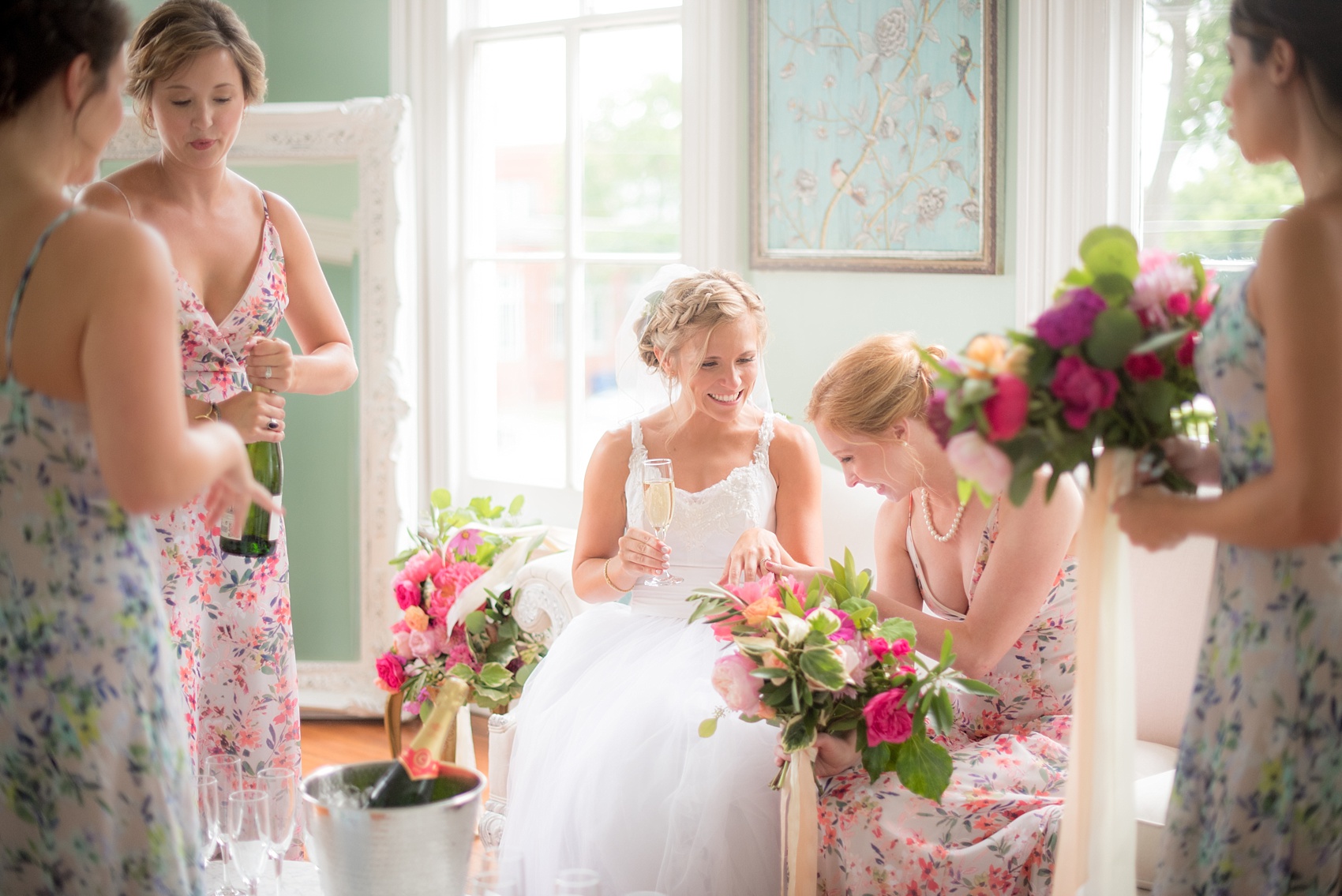 Mikkel Paige Photography wedding photos at The Merrimon-Wynne House in downtown Raleigh. The bridal party toasts to the newlyweds after their ceremony.