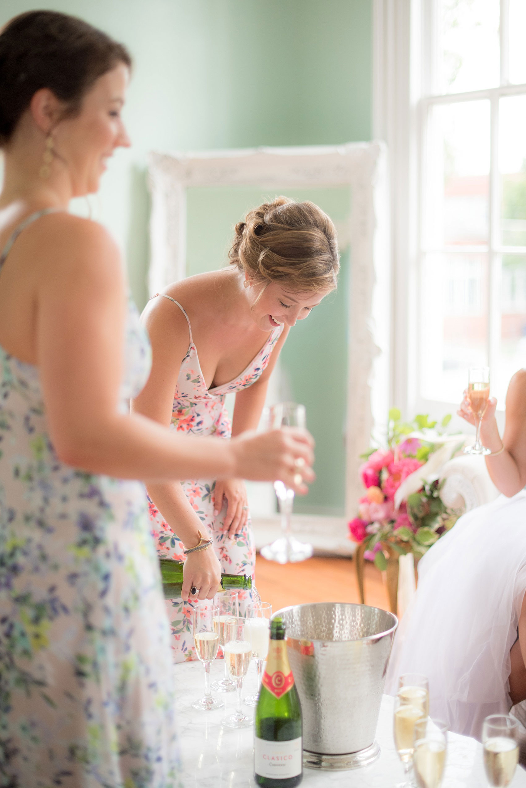 Mikkel Paige Photography wedding photos at The Merrimon-Wynne House in downtown Raleigh. The bridal party toasts to the newlyweds after their ceremony.