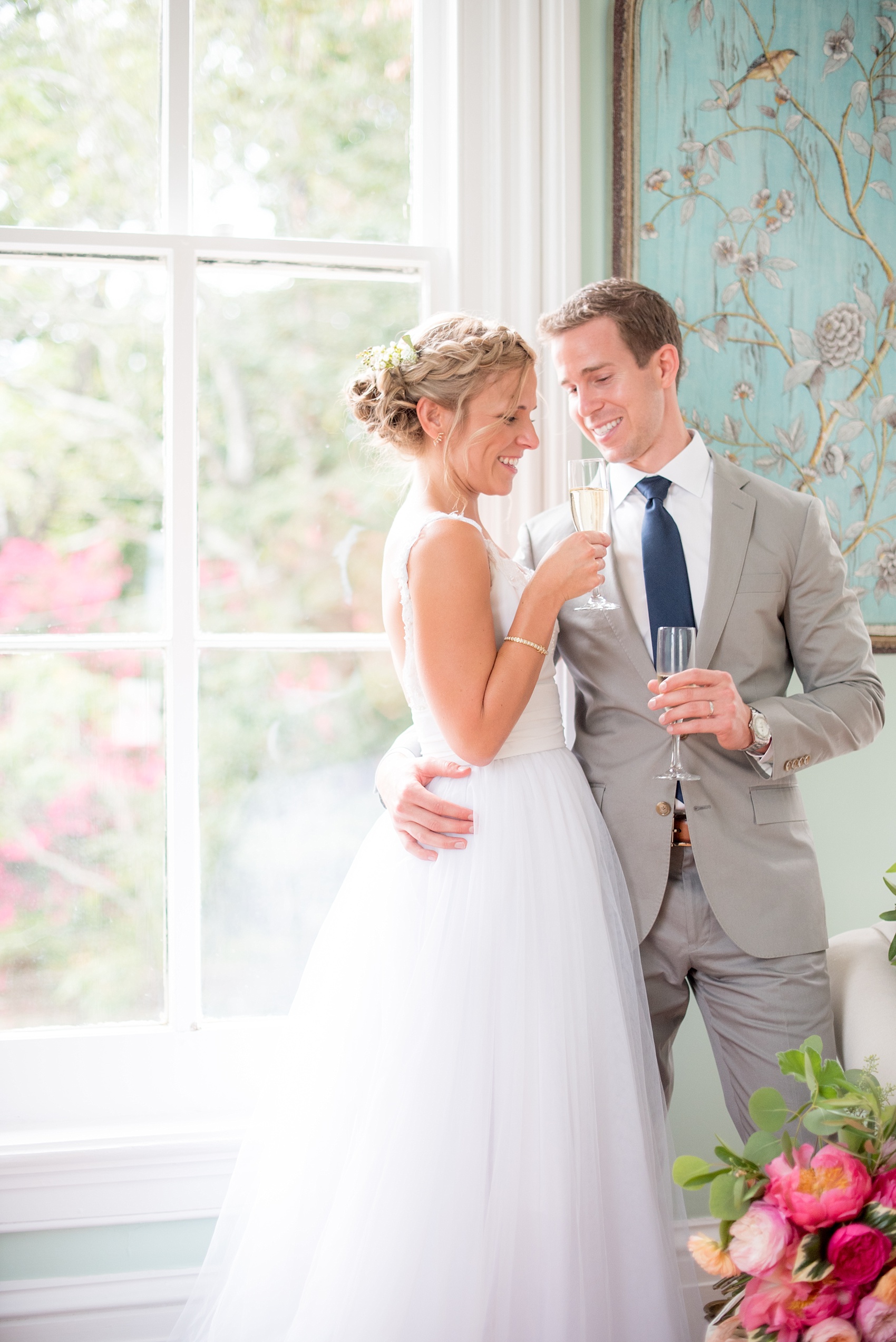 Mikkel Paige Photography wedding photos at The Merrimon-Wynne House in downtown Raleigh. The bride and groom toast to their marriage after their ceremony.