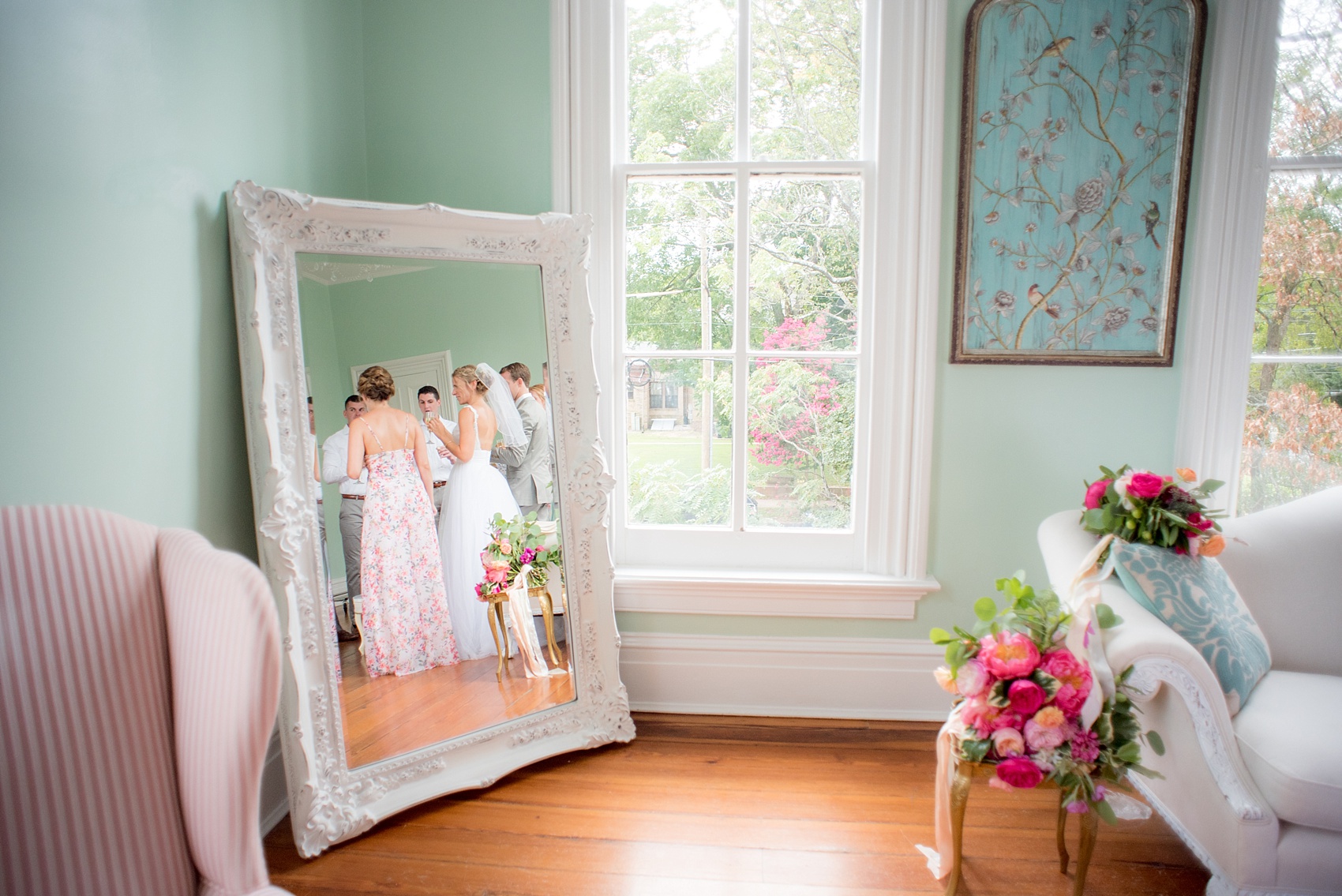 Mikkel Paige Photography wedding photos at The Merrimon-Wynne House in downtown Raleigh. The bridal party toasts to the newlyweds after their ceremony.