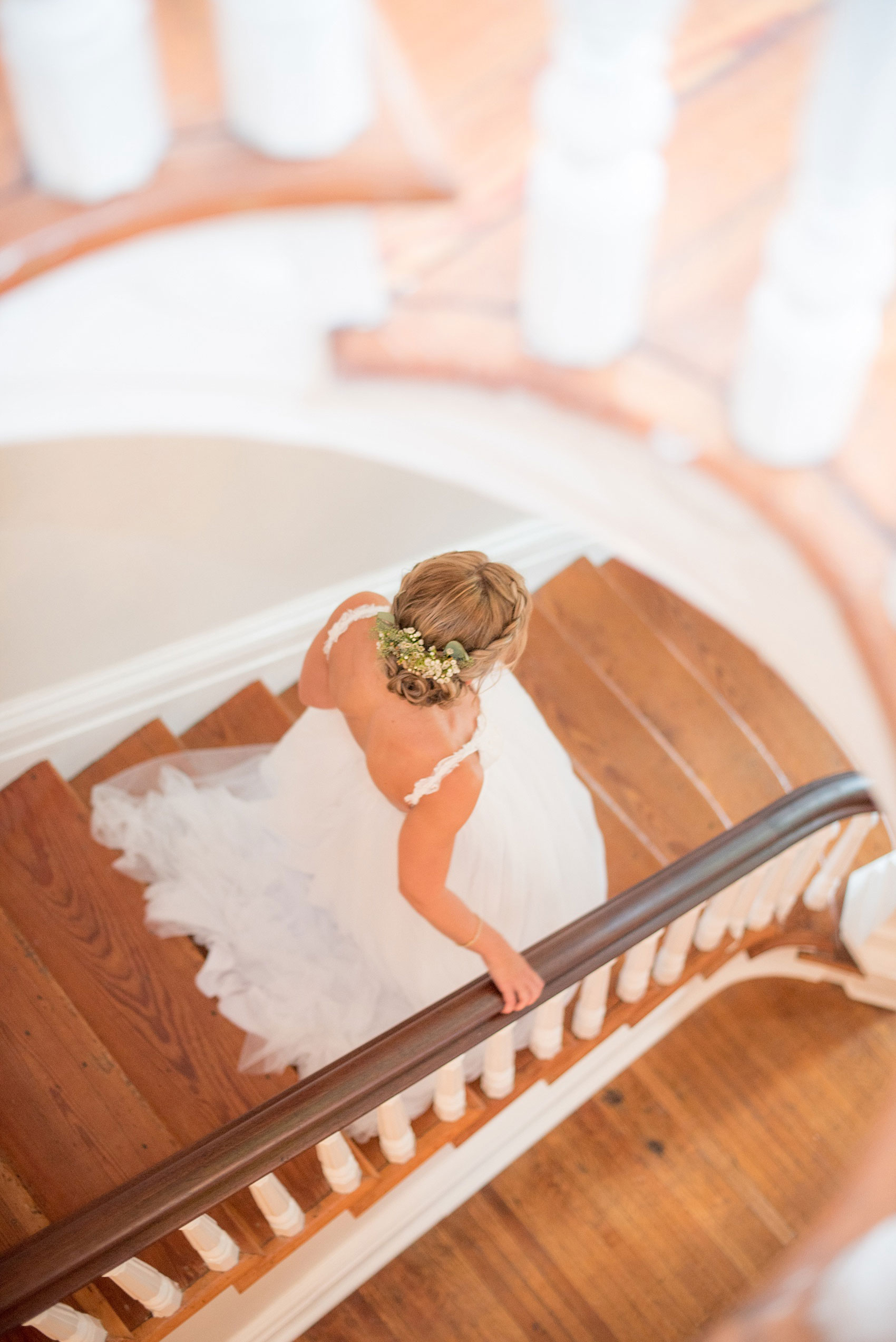 Mikkel Paige Photography wedding photos at The Merrimon-Wynne House in downtown Raleigh. An aerial view photo of the bride walking down the southern home's grand staircase.