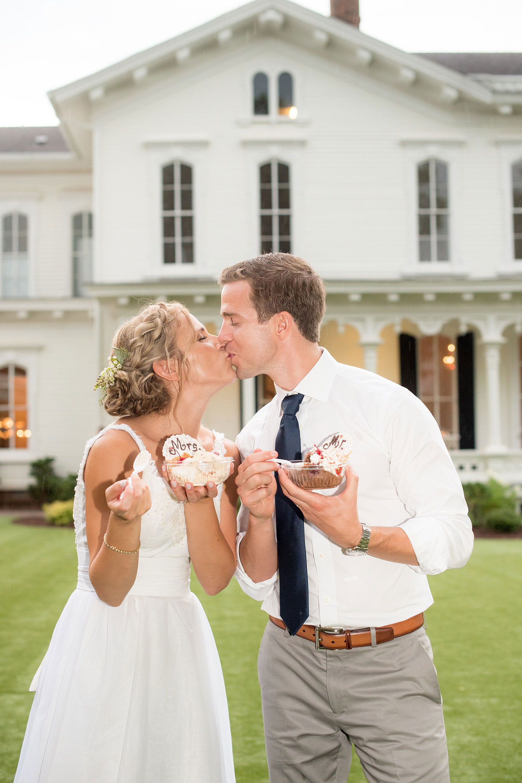 Mikkel Paige Photography wedding photos at The Merrimon-Wynne House in downtown Raleigh. A picture of the bride and groom with custom Mr. and Mrs. waffle cones from The Freezing Point ice cream bar.