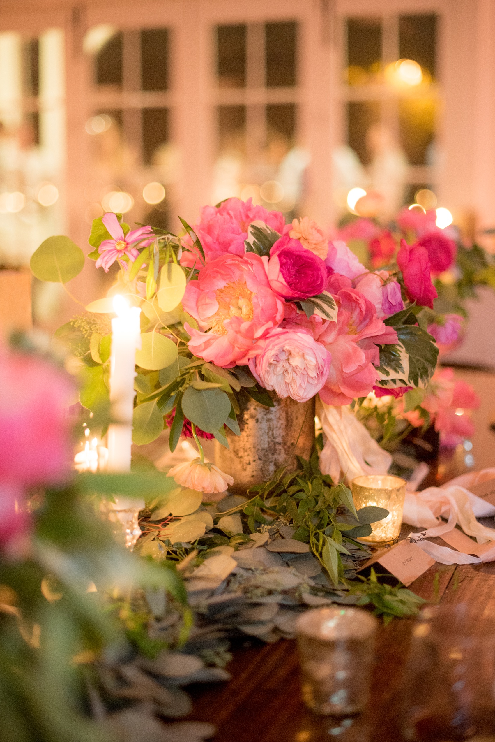 kkel Paige Photography wedding photos at The Merrimon-Wynne House in downtown Raleigh. A picture of the candlelight and farmhouse tables for the carriage house reception.