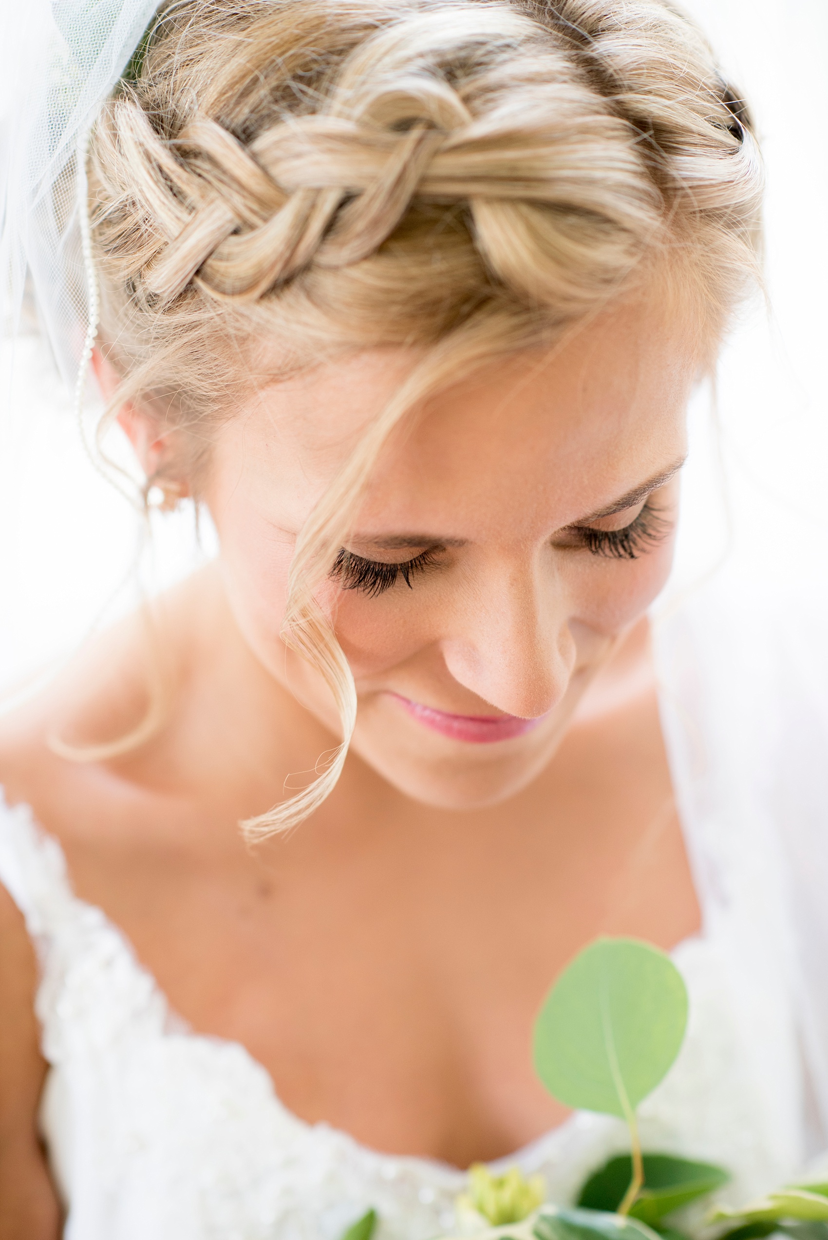 Mikkel Paige Photography photos of a wedding at The Merrimon-Wynne House in downtown Raleigh. The bride wore her hair in a flower crown braid.