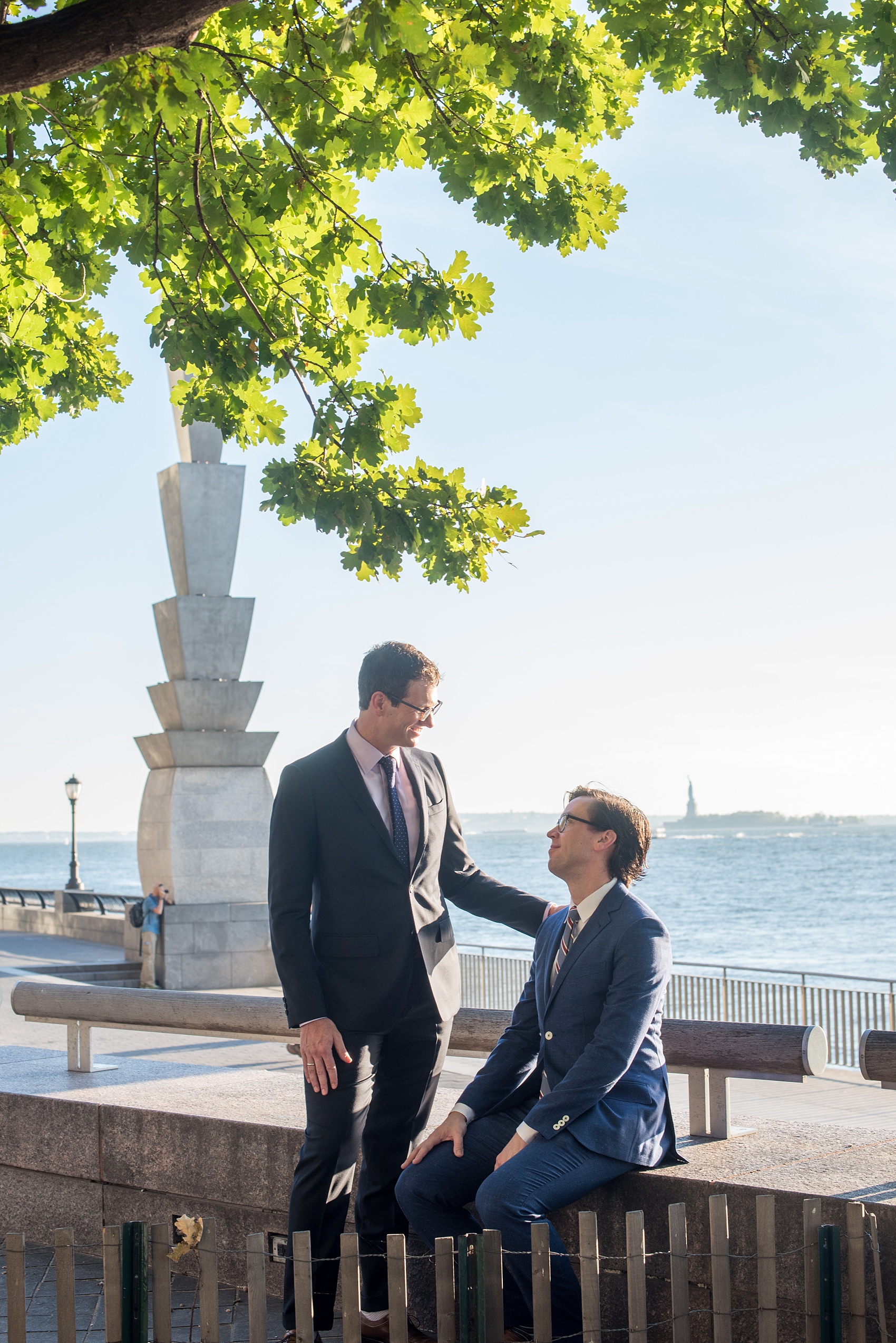 Mikkel Paige Photography photos of a same sex, gay engagement session in lower Manhattan's financial district with the grooms in custom suits.
