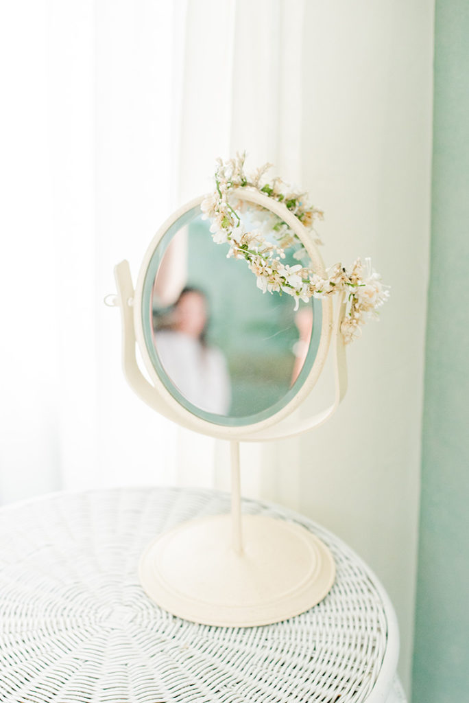 Mikkel Paige Photography photo of a rustic chic farm wedding at Spring Hill Manor, Maryland. Image of the bride getting ready for her day at Elk Forge Bed and Breakfast with her grandmother's floral crown to wear.