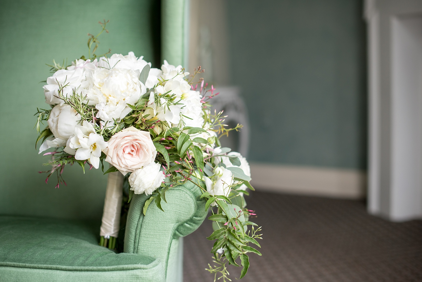 Mikkel Paige Photography photos of a wedding at Spring Hill Manor in Maryland. The bride's cascading bouquet with roses, peonies and ranunculus.