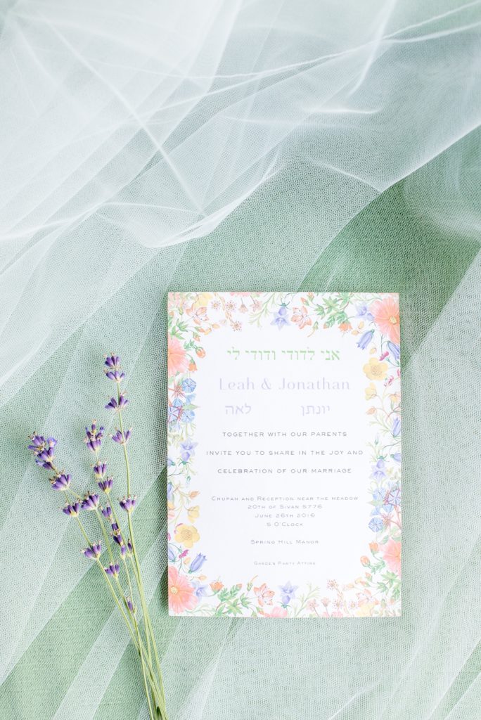 Mikkel Paige Photography photos of a wedding at Spring Hill Manor in Maryland. The couple's Paperless Post invitation printed with flower design and lavender sprigs.