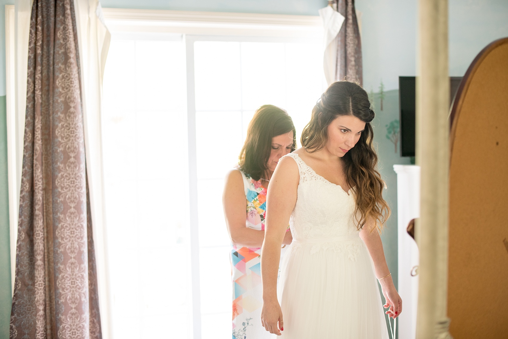 Mikkel Paige Photography photos of a wedding at Spring Hill Manor in Maryland. Image of the bride getting ready at Elk Forge Bed and Breakfast.