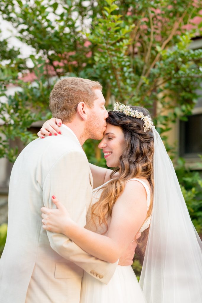 Mikkel Paige Photography photos of a wedding at Spring Hill Manor in Maryland. Image of the bride and groom kissing in the garden.