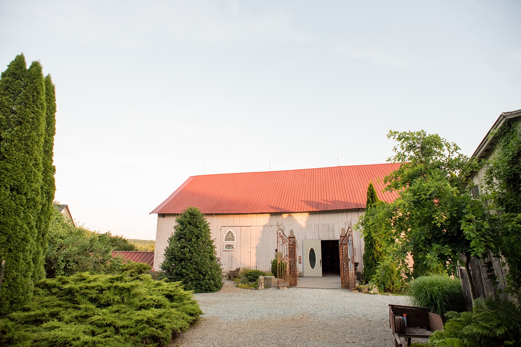 Mikkel Paige Photography photos of a wedding at Spring Hill Manor in Maryland. Image of the rustic venue at sunset.