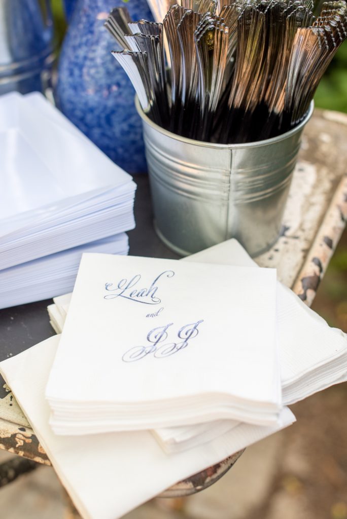 Mikkel Paige Photography photos of a wedding at Spring Hill Manor in Maryland. Image of the outdoor cocktail hour with custom napkins in purple foil.