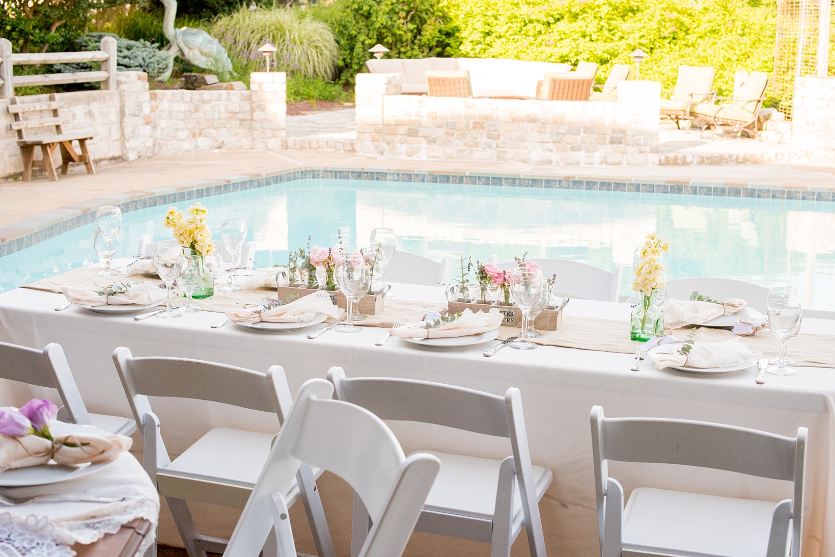 Mikkel Paige Photography photos of a wedding at Spring Hill Manor in Maryland. Image of rustic farm tables with bud vases and napkins tied with jute, eucalyptus and lavender.