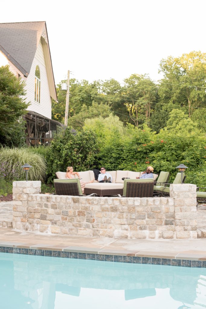 Mikkel Paige Photography photos of a wedding at Spring Hill Manor in Maryland. Image of the guests enjoying the outdoor pool areas.