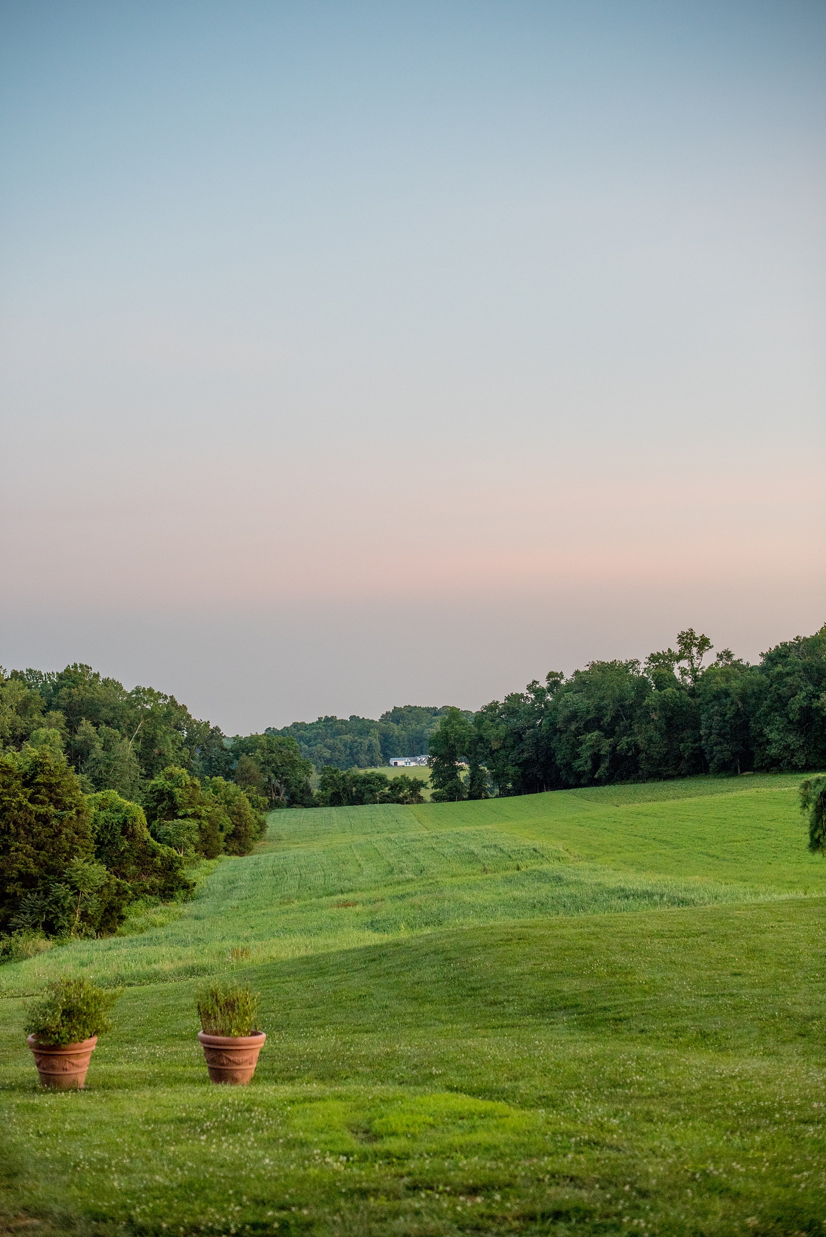 Mikkel Paige Photography photos of a wedding at Spring Hill Manor in Maryland. Image of the sunset over the hills.