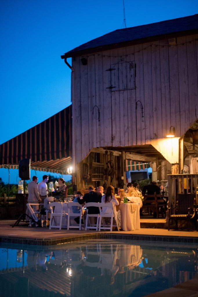 Mikkel Paige Photography photos of a wedding at Spring Hill Manor in Maryland. Night time image of the outdoor reception by the pool.