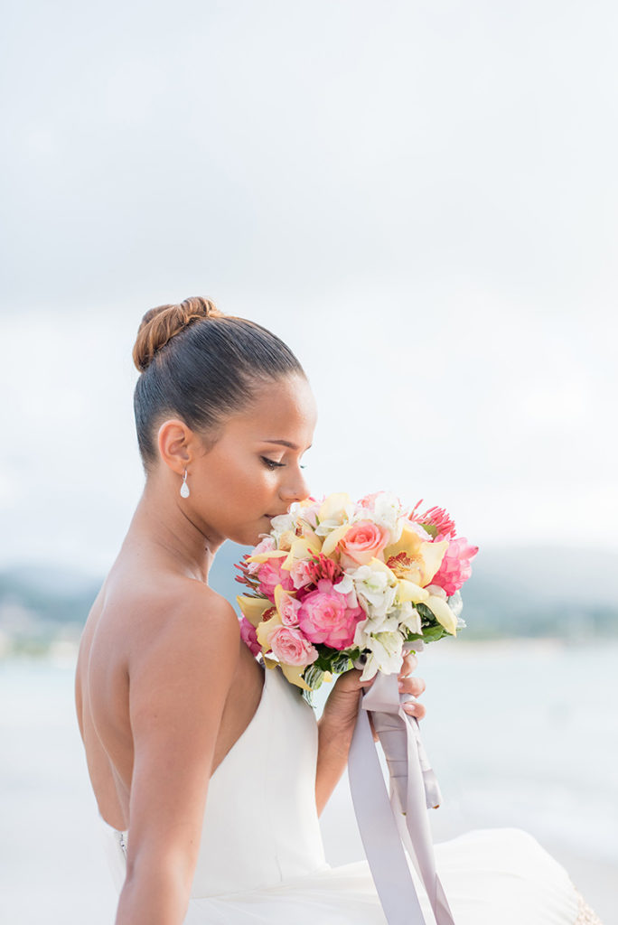 Mikkel Paige Photography photos of a bride in St. Lucia at The Landings with a tropical bouquet.