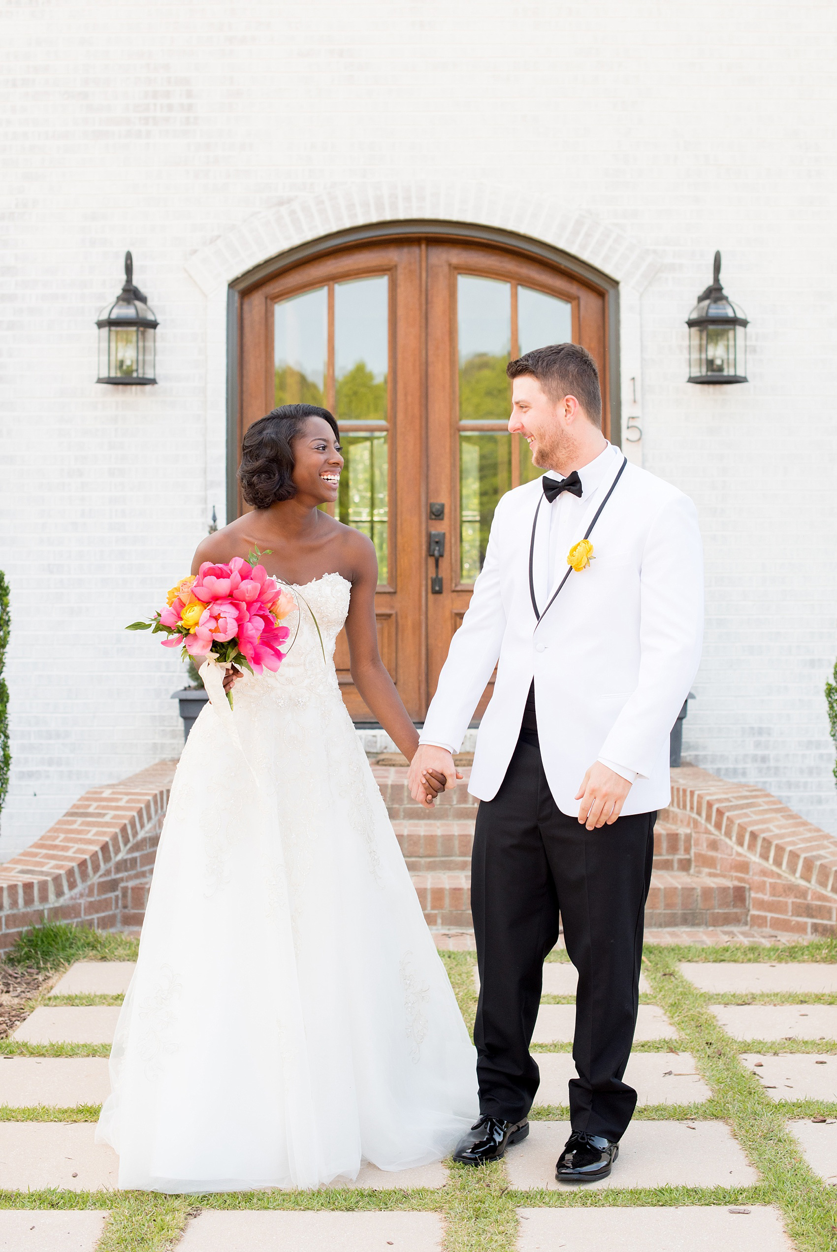 Mikkel Paige Photography photo at The Bradford, NC. Bride and groom of mixed race on the steps of the elegant NC home.