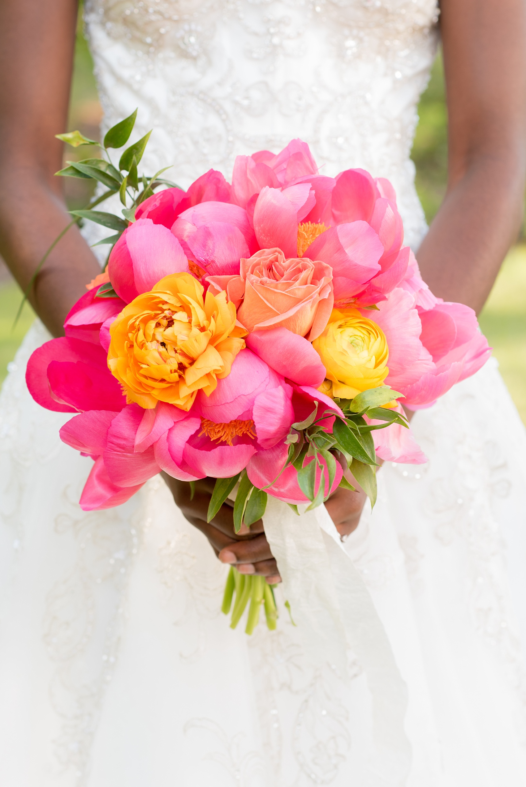 Mikkel Paige Photography wedding photo at The Bradford, NC. Bride's pink peony and yellow ranunculus bridal bouquet. 