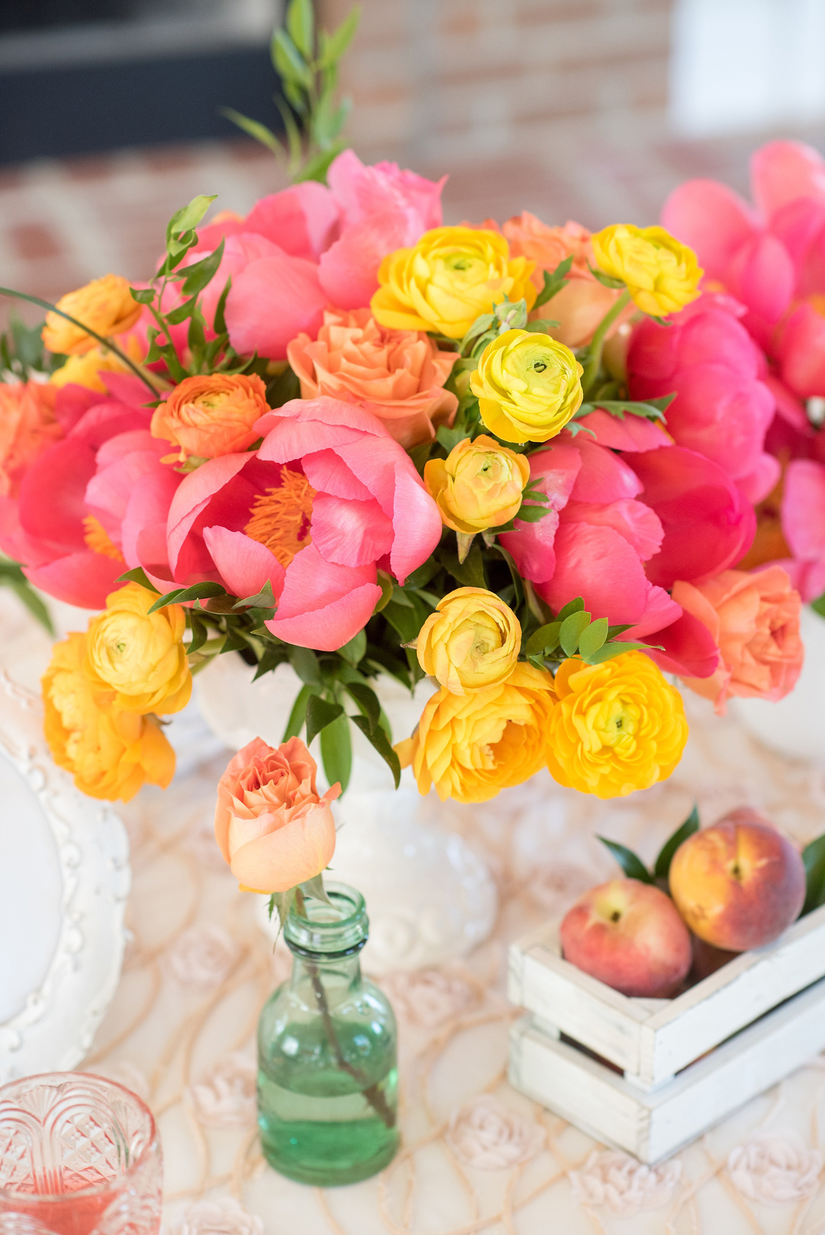 Mikkel Paige Photography wedding photo at The Bradford, NC. Modern pink, black and white table setup. Peonies and ranunculus and shabby chic peach holders.