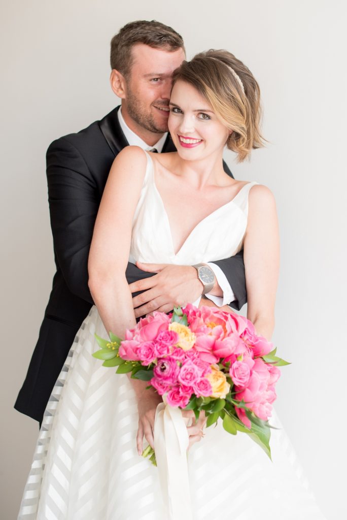 Mikkel Paige Photography photo of Dobbin St Brooklyn wedding. Striped white gown by Hayley Paige and pink peony bouquet. Planning and coordination by Color Pop Events.