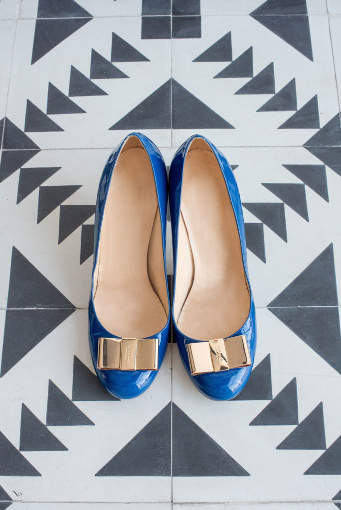 Mikkel Paige Photography photo of Dobbin St Brooklyn wedding. Blue Kate Spade shoes for the bride with planning and coordination by Color Pop Events.