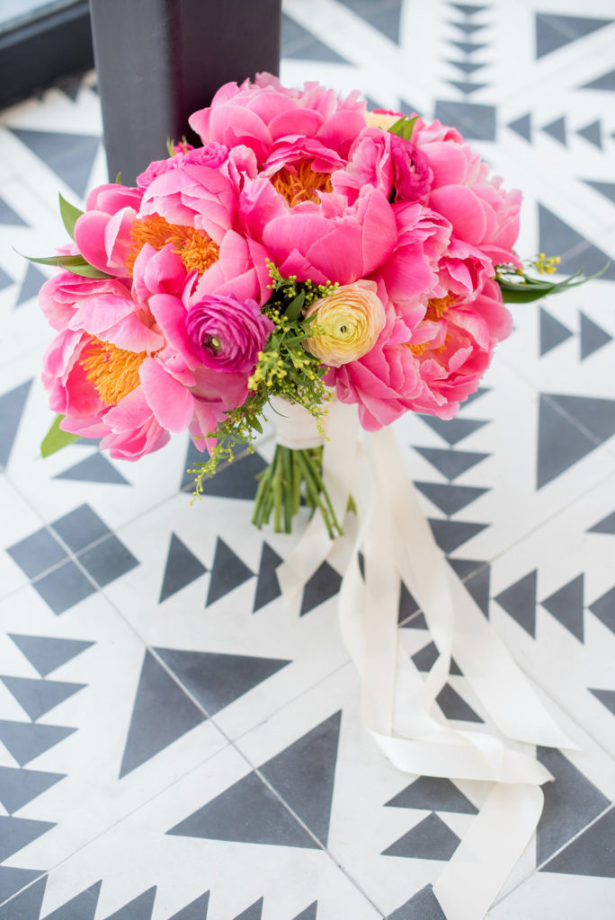 Mikkel Paige Photography photo of Dobbin St Brooklyn wedding. Planning and coordination by Color Pop Events with a peony and ranunculus bouquet by Blade NYC.